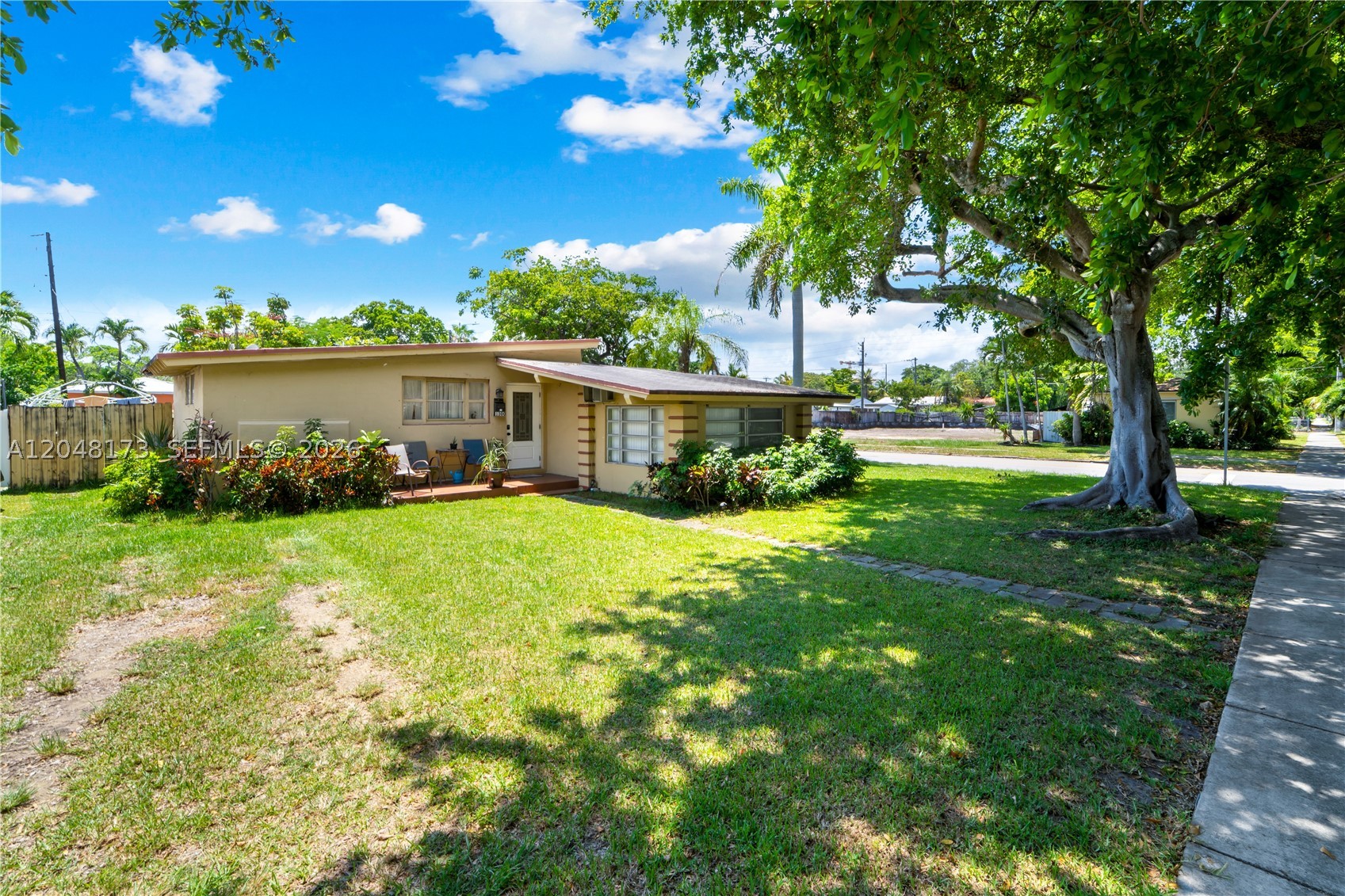 Great corner property! This home features 3 bedrooms, 2 full baths, plus large Den, could easily be used as a 4th bedroom. Master suite has walk in closet. Living room has exposed wood beams. Laundry Room. 1 car carport. Fenced backyard. Walking distance to downtown Hollywood, short drive to Hollywood Beach and Hollywood Ft. Lauderdale Airport