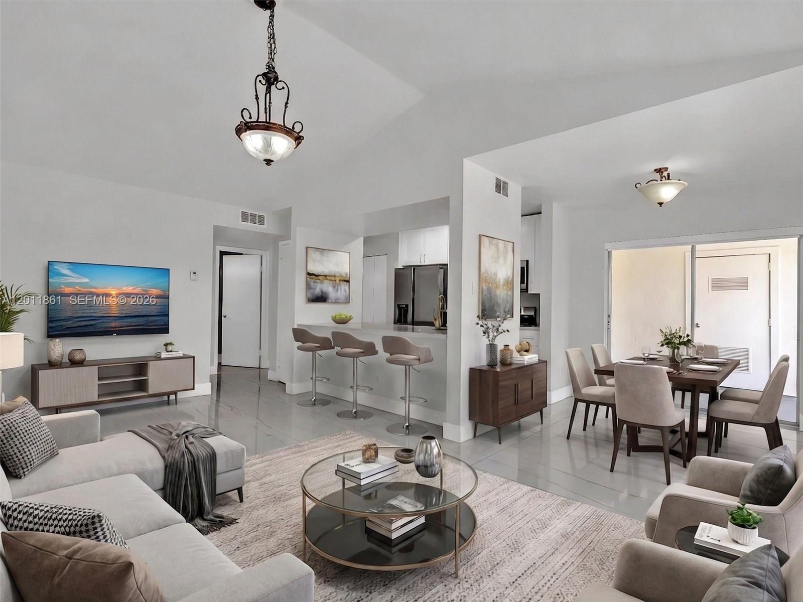Completely updated and move-in ready 3rd-floor condo with two assigned parking spaces in the heart of Kendall! This beautifully renovated unit features a modern kitchen with quartz countertops, stainless steel appliances, and ample cabinetry. Both bathrooms have been fully updated with contemporary finishes, and porcelain tile floors run throughout for a clean, elegant look. Enjoy the convenience of an in-unit washer and dryer and unwind on your private balcony.

The community offers a resort-style lifestyle with a swimming pool, spa, beach-style lake with sand and volleyball net, and a scenic walking path around the lake. Residents also enjoy a fitness center currently being renovated for an enhanced experience.

Ideally located near shopping, dining, top-rated schools, and major highways, this property offers the perfect blend of comfort, style, and convenience. Ideal for end-users or investors seeking a turnkey opportunity in a highly desirable area. Monthly Maintenance: $575,  Quarterly HOA: $212.38