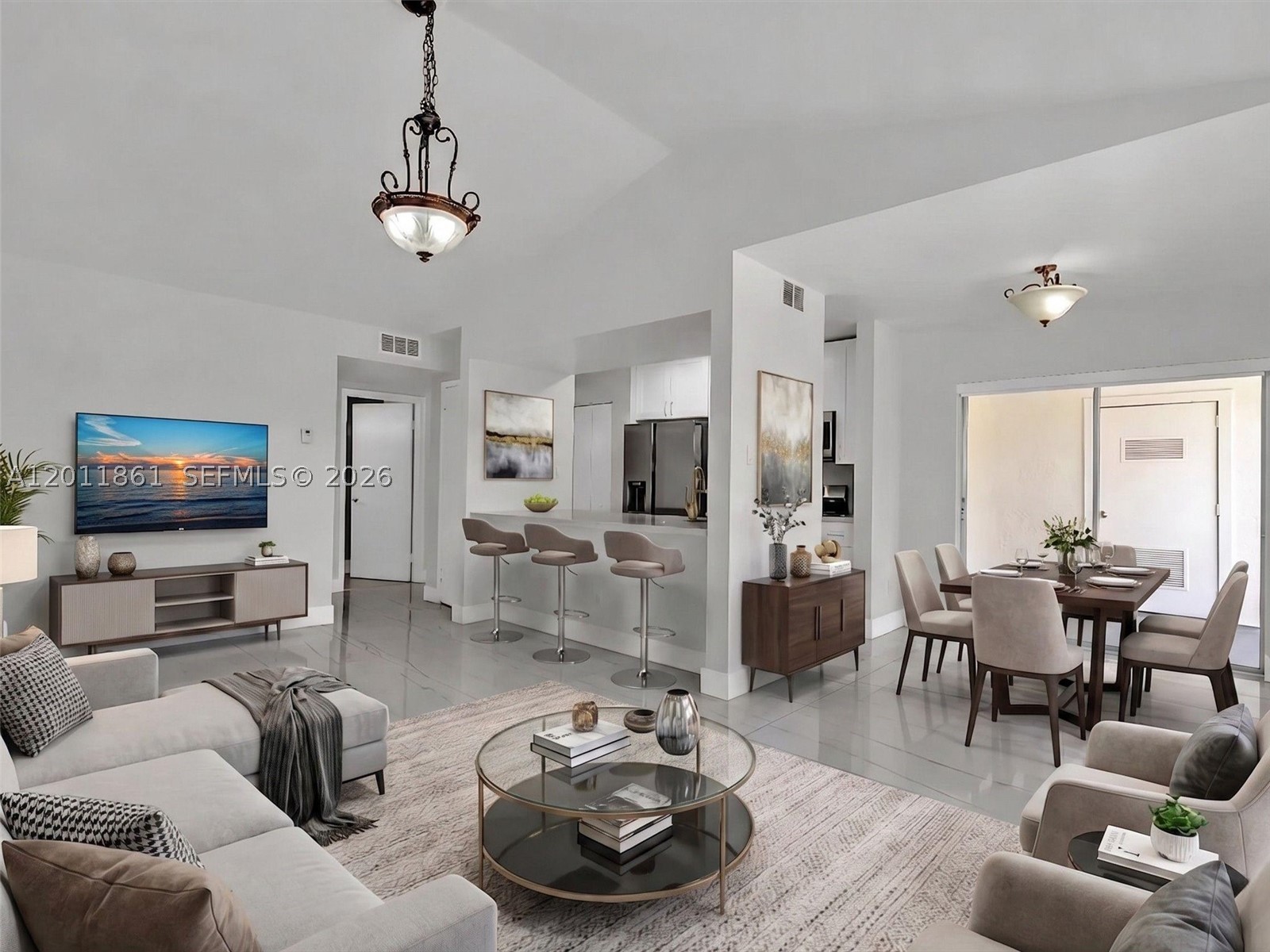 Completely updated and move-in ready 3rd-floor condo with two assigned parking spaces in the heart of Kendall! This beautifully renovated unit features a modern kitchen with quartz countertops, stainless steel appliances, and ample cabinetry. Both bathrooms have been fully updated with contemporary finishes, and porcelain tile floors run throughout for a clean, elegant look. Enjoy the convenience of an in-unit washer and dryer and unwind on your private balcony.

The community offers a resort-style lifestyle with a swimming pool, spa, beach-style lake with sand and volleyball net, and a scenic walking path around the lake. Residents also enjoy a fitness center currently being renovated for an enhanced experience.

Ideally located near shopping, dining, top-rated schools, and major highways, this property offers the perfect blend of comfort, style, and convenience. Ideal for end-users or investors seeking a turnkey opportunity in a highly desirable area. Monthly Maintenance: $575,  Quarterly HOA: $212.38
