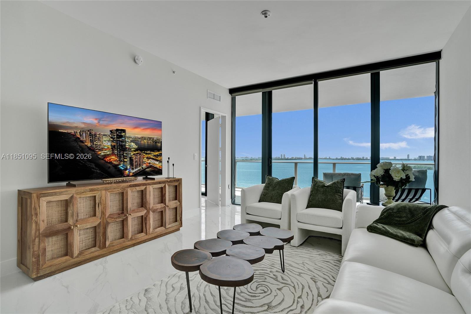 Experience refined luxury at Aria Reserve South Tower, perfectly situated in Miami’s vibrant Edgewater neighborhood. This flow-through residence offers 2 spacious bedrooms + office/den and 3  bathrooms, with floor-to-ceiling glass capturing sweeping Biscayne Bay and Atlantic Ocean views to the east; and stunning sunset views from the secondary bedroom to the west.

Thoughtfully upgraded and move-in ready. Enjoy custom-finished closets throughout, including a primary suite closet with elegant backlit lighting. The bathrooms have been enhanced with new mirrors with backlighting and added shower/tub glass enclosures, elevating the look and functionality. Premium shades and blackout curtains in the bedrooms complete the comfort-forward design.

Residents enjoy world-class, resort-style amenities, including a pool, state-of-the-art fitness center, spa, sports courts, kids’ areas, putting green, movie theater, and a wine lounge; all just minutes from Wynwood, the Design District, and Miami Beach.
