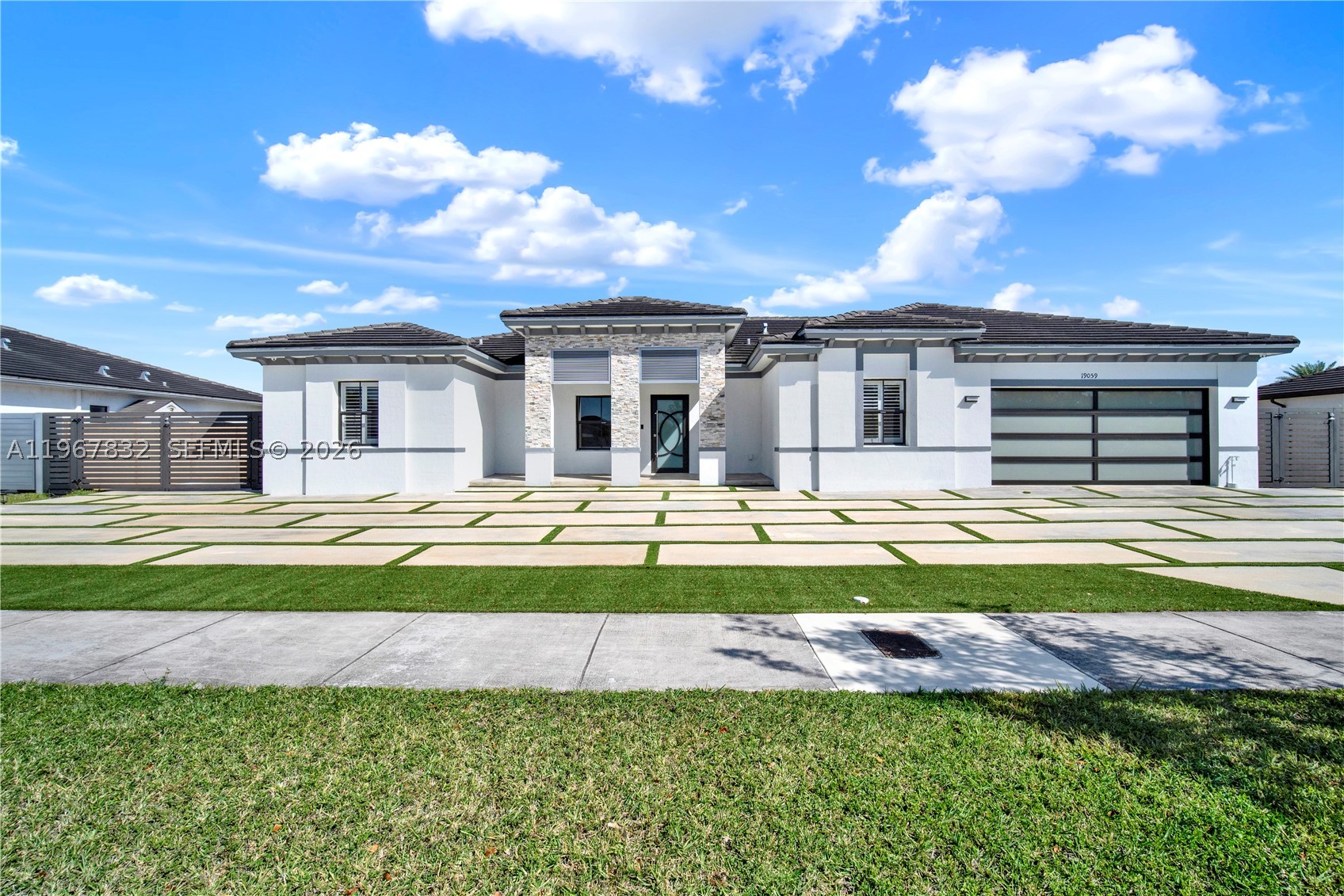Stunning smart home in Galiano Estates (Vilhen Drive) NO HOA, offering 3,523 sq. ft. of total living area on a 12,540 sq. ft. lot. This spacious open floor plan features 5 bedrooms and 4.5 bathrooms. Modern kitchen with large quartz island, stainless steel appliances, and ample cabinetry. Porcelain floors throughout. The owner’s suite includes a double vanity and a rain shower. The house also includes impact windows and doors and a hurricane-rated garage door. Electric water heater, washer, and dryer included. A large concrete driveway with ample parking and room for recreational vehicles such as an RV or a boat. Enjoy the attached pergola overlooking the canal and a fully fenced yard with canal access. A perfect blend of comfort, style, and functionality. Enjoy!!!
