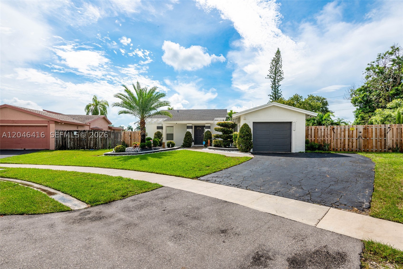 Welcome to this beautifully renovated 3-bedroom, 2-bathroom home, featuring a spacious open-concept layout and an incredible backyard designed for relaxation. Enjoy a brand-new pool, a large fenced-in yard, and serene canal views—the perfect setting for unwinding or entertaining guests. The property boasts a new roof and impact-resistant windows, a smart EV charging station (Level 2), security cameras, and an irrigation system, blending comfort, efficiency, and modern amenities. Strategically located near top-rated schools, shops, restaurants, and major highways, this move-in-ready home offers a unique opportunity to enjoy the best of the South Florida lifestyle. MORE PHOTOS COMING SOON!