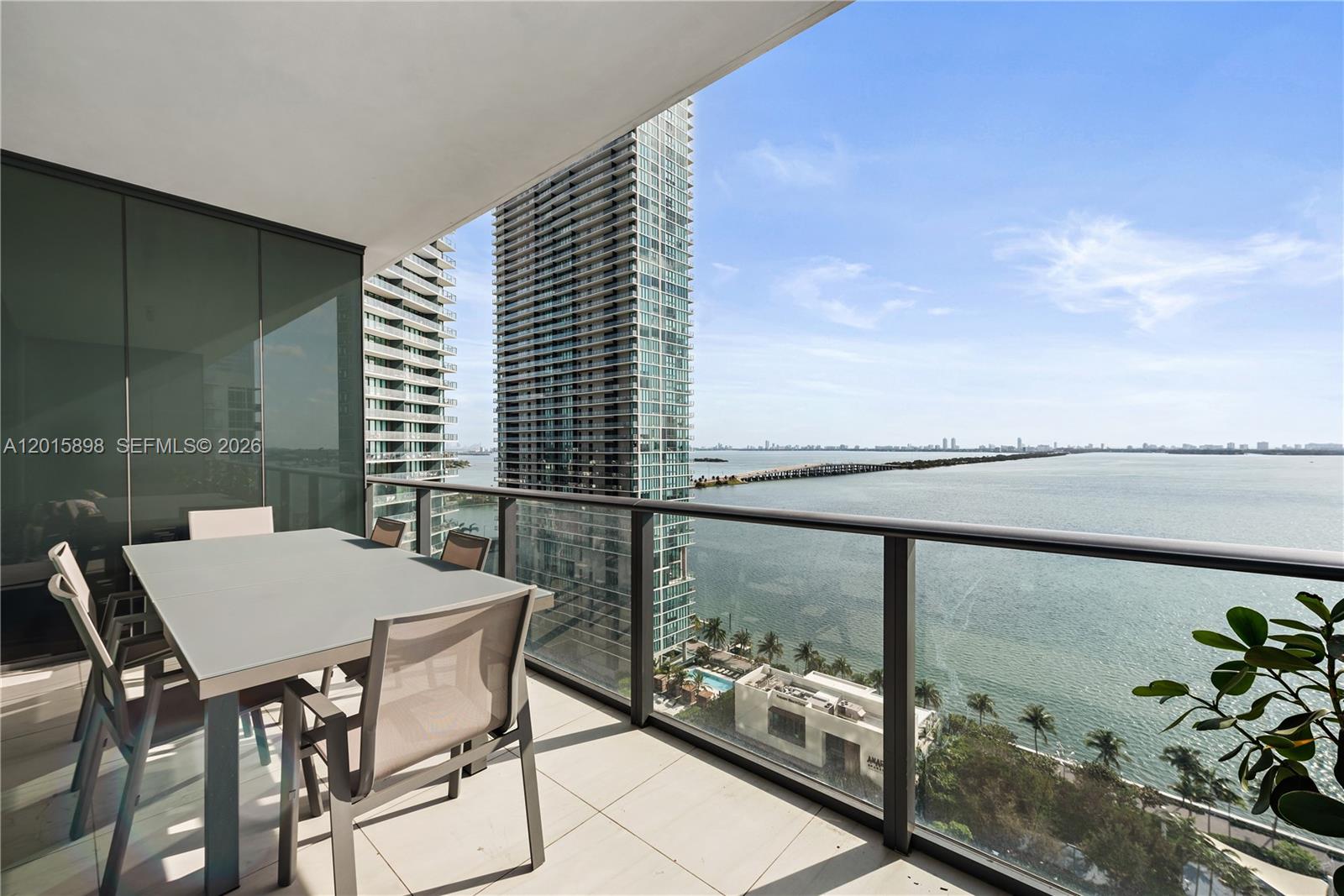 Perfectly located in the heart of Edgewater, this spacious 1 bedroom + 2 full bath w/ private elevator offers one of the best views in Miami over Biscayne Bay and Miami Beach Skyline. The unit is turnkey with marble floors throughout. Gourmet kitchen with Sub Zero and Wolf appliances. Custom walk-in and built-in closets, blinds and black outs in the bedroom and living room. Large balcony perfect for entertaining and enjoying the amazing direct bay views. 2 parking spaces. Internet, cable and water included. Don't miss the exclusive high end amenities with infinity pools, tennis courts, movie theater, gym, sauna, spa, wine and cigar lounge, and more incredible views!