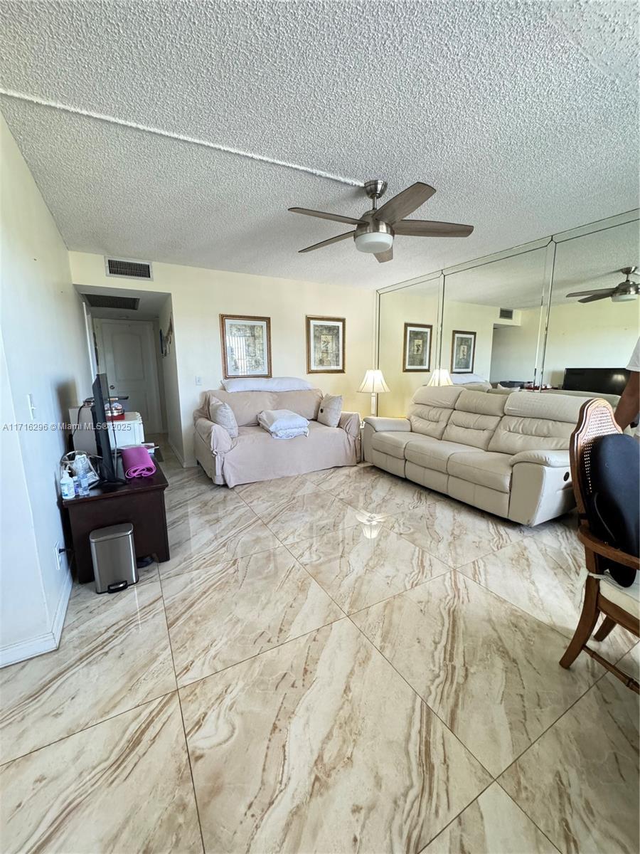 Fantastic opportunity! Beautiful 2/1/1 condo in Kingsley - Century Villages. All-tile flooring, spacious living/dining areas, 2 large bedrooms with ample closets, private screened patio, extra storage. 55+ community with free transportation, clubhouse, theater, gym, billiards, games, covered pool, sauna, and more! Prime location near malls, restaurants, hospitals, banks. 24/7 security-gated community. Amenities: tennis, golf, theater, gym, health facilities, library, clubhouse, pools, and more. Ideal for primary residence or investment!