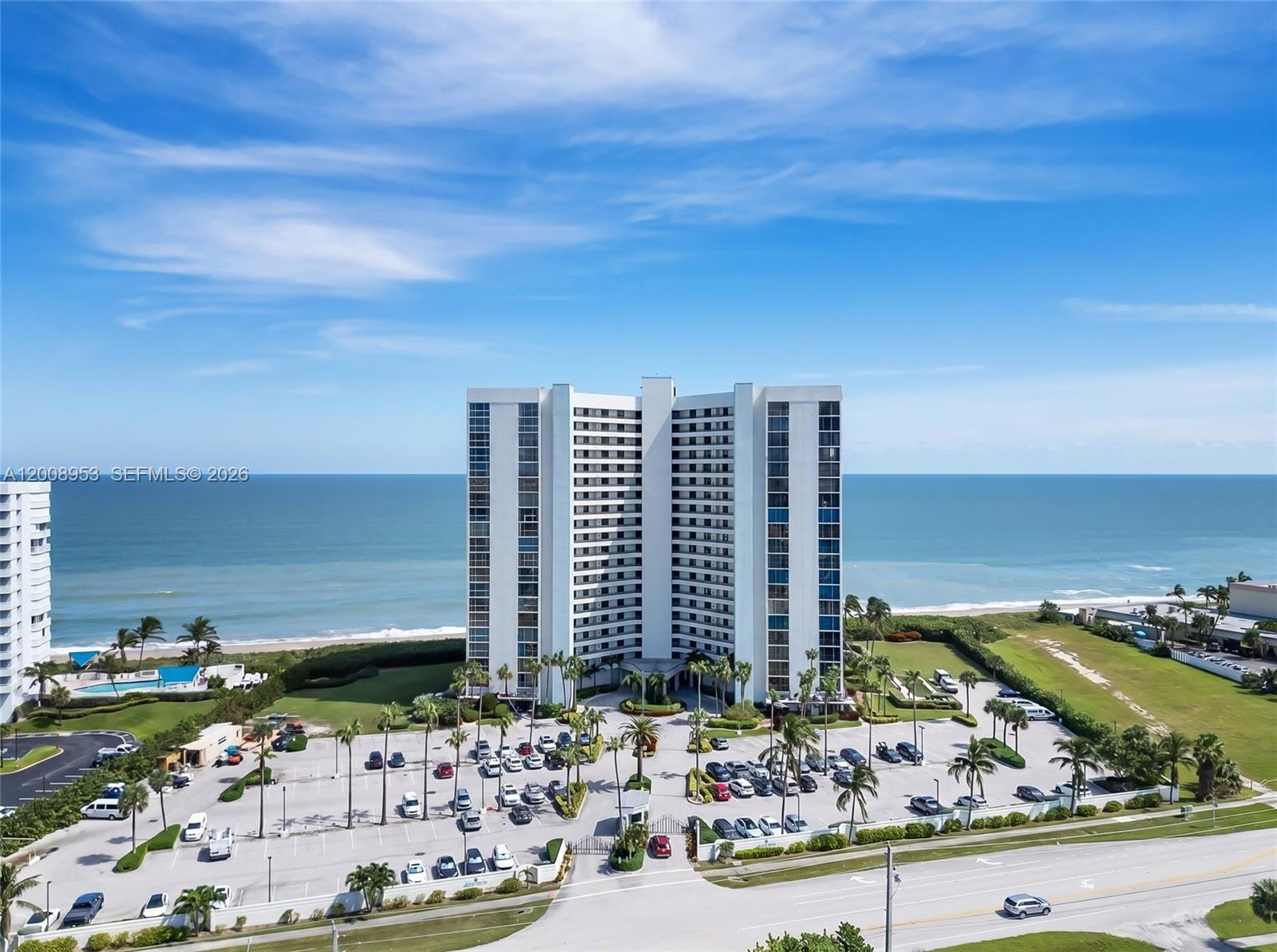 Wake up to the sound of waves and sunrise over the Atlantic in this beautifully renovated 2-bedroom, 2-bath oceanfront condo. Offering almost 1,300 square feet of thoughtfully designed living space, this residence blends comfort, style, and easy coastal living. Step inside to sweeping ocean and intercoastal views that fill the open-concept layout. The modern kitchen features quartz countertops, stainless steel appliances, and white shaker cabinetry. A custom bar with a built-in wine refrigerator adds the perfect touch for entertaining or relaxing at the end of the day. This turnkey home is fully furnished with tasteful, coastal-inspired décor, making it ideal for full-time living or a seasonal escape. Recent upgrades include LVP flooring, remote control blinds, and hurricane impact windows and doors, along with accordion shutters for added protection. Located in a private, gated beachfront community, residents enjoy resort-style amenities including a heated pool and spa, outdoor kitchen, tennis and pickleball courts, fitness center, sauna, and social spaces. Direct beach access, a secured lobby, and additional storage complete the package. Move right in and start enjoying the oceanfront lifestyle—just bring your essentials.