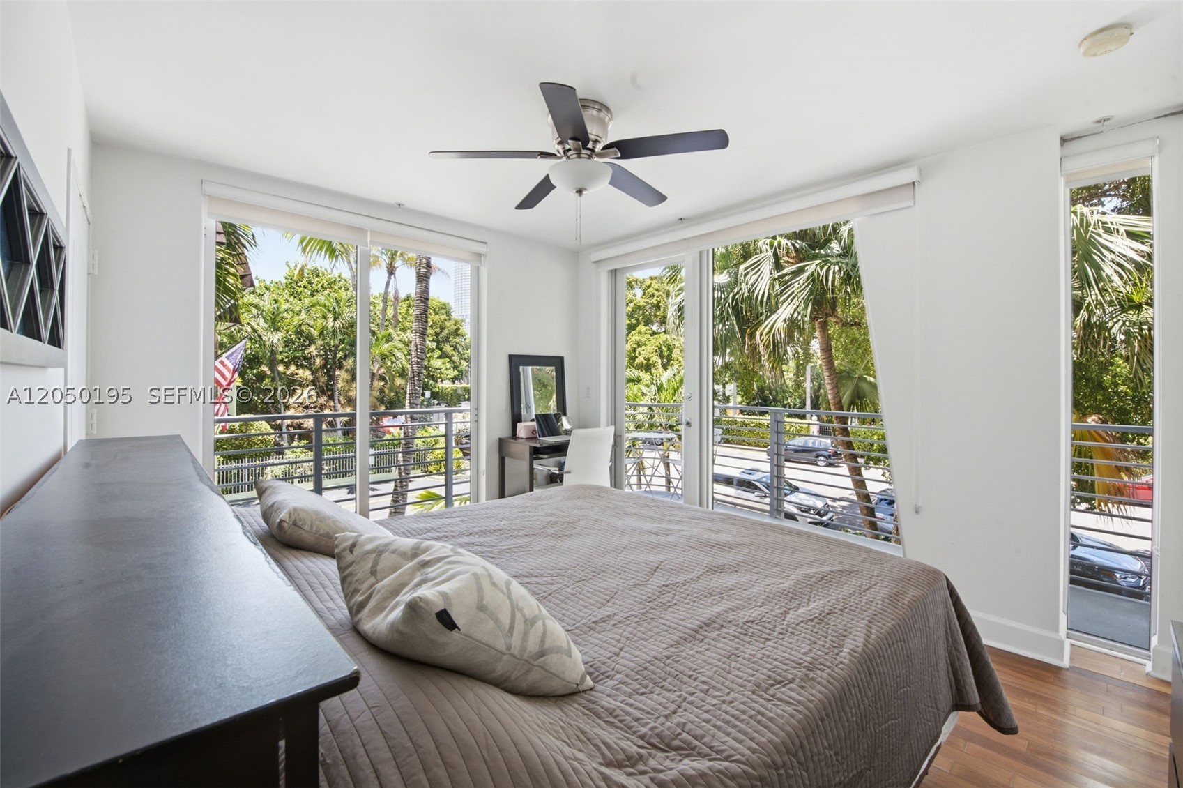 Sun-drenched 2BR/2.5BA South Beach Home with open roof top terrace and wrap around balcony. Corner unit, set in a newer (2007) boutique building in the heart of Flamingo Park, the unit is wrapped in oversized sliding high impact glass doors that flood every room with natural light, opening onto a rare wrap-around balcony shaded by palms. You're a short walk from South of Fifth, Lincoln Road, and the sand, with the MacArthur Causeway right around the corner for an easy run into Miami. Walking distance to the finest restaurants, shopping and the beach. Fully furnished and turnkey, just bring your suitcase. This is a true seasonal opportunity: move in now and be settled well before the holidays, with the lease running through the end of January. Covered, assigned parking included. The building is quiet and well cared for, and we're looking for a tenant who'll match that!