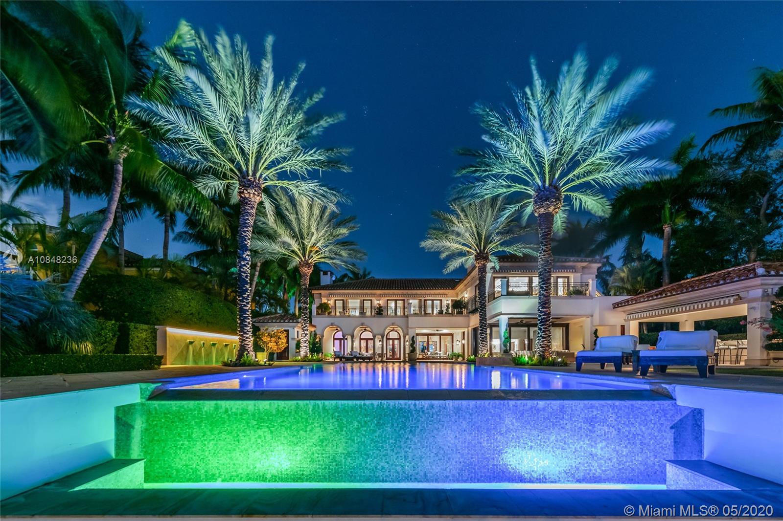 This amazing contemporary 2-Story waterfront estate on exclusive, guard-gated Star Island exemplifies luxury living. The estate sits on a manicured 40,000 SF lot & offers 15,011 SF & 100FT of WF w/direct Biscayne Bay & Miami skyline sunset views. Home features exquisite stone floors, Venetian plaster walls, elevator & living room that opens to the private formal dining room, an industrial-style chef’s kitchen, library/den, wine room & great room that opens to the pool area. The 2nd floor principal suite sports a sitting room, office & 2 large terraces w/bay views, plus a bathroom w/expansive onyx/glass steam shower, large walk-in closet & custom spa tub. Outdoor highlights include: pool w/Jacuzzi, cabana bath, covered bar, private 100FT IPE wood dock & Atlantic Ocean access.