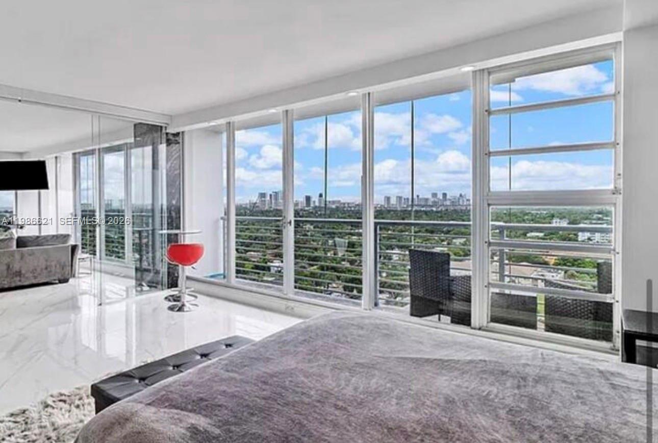High-floor 1BR/2BA in the heart of Hollywood Circle with stunning city and distant ocean views. Floor-to-ceiling impact-proof windows fill the space with natural light, while multiple private balconies create seamless indoor-outdoor living. Open layout with updated kitchen, modern finishes, and spacious living/dining areas.

Primary suite features a private bath; second full bathroom adds flexibility for guests use. Ideal for end-users or investors with strong rental potential.

Prime location just steps to dining, shopping, parks, and nightlife, and minutes to the beach and Fort Lauderdale-Hollywood International Airport.