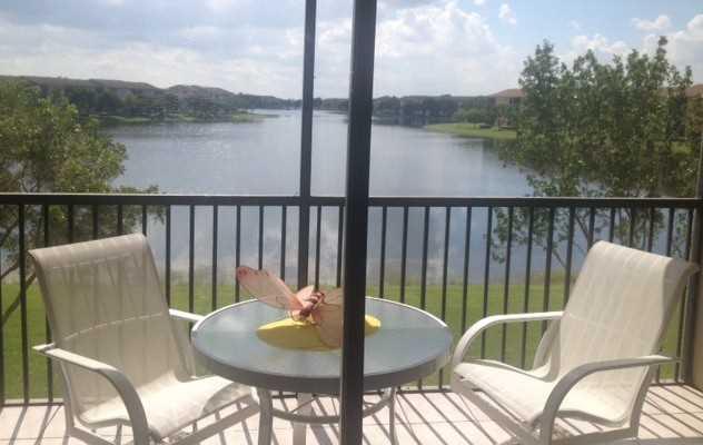 NEW LISTING! WHAT A VIEW! One of the longest and best lake views in the entire community. Split two bedroom. Unit has its own washer and dryer. Neutral tile floors throughout. Impact windows in the front windows with shutters off the balcony. Service cont ract on appliances. Owners moving very shortly so ready for quick occupancy. Easy to show. 55 or older age community. Very easy to show and priced to sell.