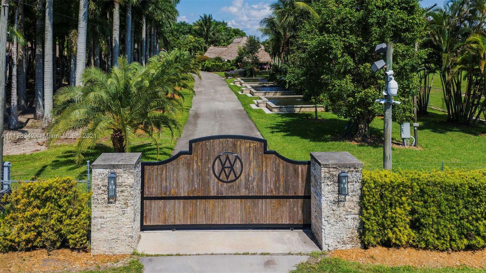 LOVELY LANDSCAPED HORSE TRAINING RANCH/BOARDING FACILITY OFFERS 25 INDOOR HORSE STALLS W/6 OVERSIZED TURNOUT PADDOCKS & STALLS. INC. 2 TOP OF THE LINE HORSE WALKERS, 2 WASH PENS, TACK ROOM & LIVING QUARTER FOR CARETAKER. UPON ENTERING THE VENUE 3 FULLY IND. KOI PONDS W/WATERFALLS AND TIKI BIRD CAGES. COZY YET LUXURIOUS RANCH FEEL. TIKI VENUE IS FULLY EQUIPPED W/OUTDOOR GRILL, KITCHEN, DRAFT COOLER, SERVING BAR & AMAZING LIGHTING THROUGHOUT THE PROPERTY THAT MAY BE RENTED OUT FOR DAY OR NIGHT EVENTS SUCH AS WEDDINGS, PARTIES, BABY SHOWERS, PHOTO SHOOTS & MUCH MORE. FULLY FENCED & ALL LANDSCAPED AREAS ARE SET UP W/AUTO SPRINKLERS BY ZONE. DON'T MISS THIS HIDDEN GEM & INCOME PRODUCING VENUE!