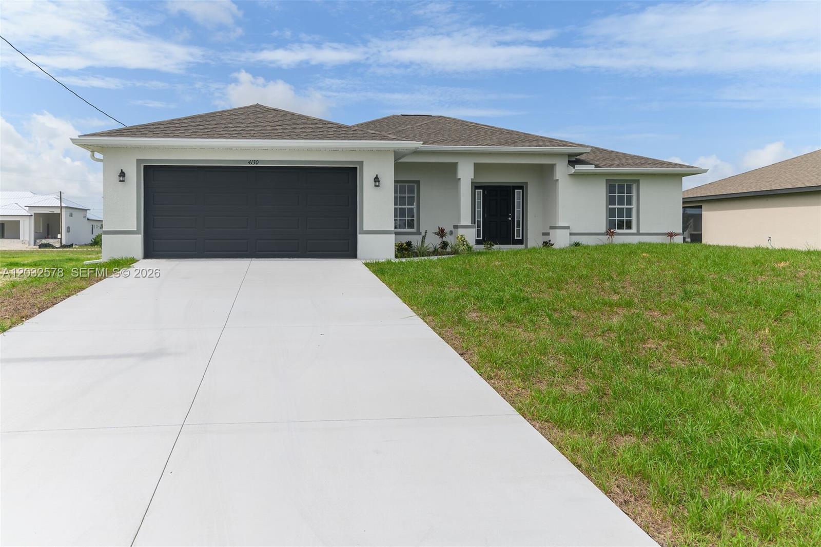NEW CONSTRUCTION IN NW CAPE CORAL!

Welcome to this beautifully designed new construction home offering 4 bedrooms, 3 full bathrooms, and an open-concept floor plan that blends modern style with everyday functionality.

The spacious kitchen features quartz countertops, stylish cabinetry, stainless steel appliances, and a large island overlooking the living and dining areas, creating the perfect space for entertaining and daily living. High ceilings and abundant natural light enhance the home's bright and welcoming atmosphere.

The private owner's suite serves as a relaxing retreat with a walk-in closet and beautifully appointed en-suite bath. One of the secondary bedrooms also features its own private en-suite bathroom—an exceptional feature that provides added comfort and privacy for guests, extended family, or multi-generational living. Two additional bedrooms share convenient access to the third full bathroom.

Situated on a generously sized homesite in the growing Northwest Cape Coral area, there is plenty of room to create your dream outdoor living space, including a future pool. Conveniently located near shopping, dining, boating, golf, parks, and all that Southwest Florida has to offer, this home combines quality construction, thoughtful design, and modern comfort.

Why wait to build when you can move into a brand-new home today?