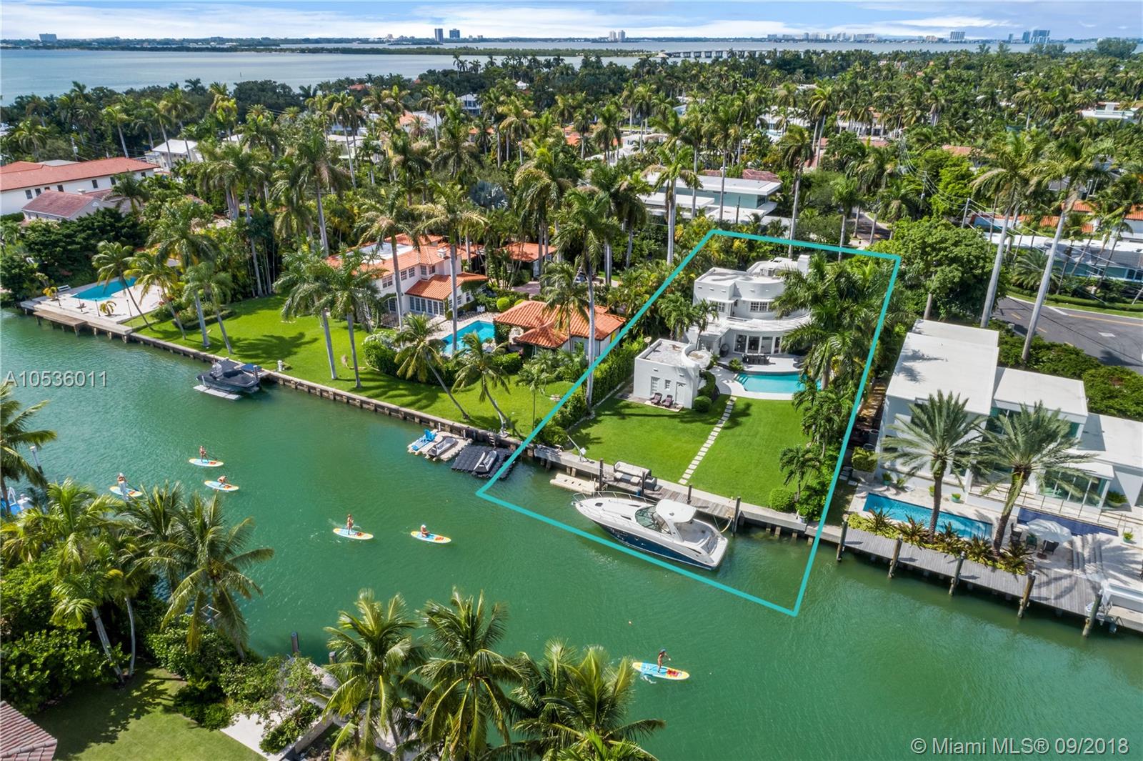 Enjoy waterfront living in the heart of Miami Beach on coveted Sunset Island III. This 5 bedroom 4.5 bathroom art deco-styled home offers 75 ft on the water, built in dock, and direct access to open bay. Sitting on a manicured 13,125 SqFt lot this residence is complete with 2 fireplaces, 2 car garage, and Florida room with an abundance on natural light. Expansive terrace off master bedroom allows for ultimate privacy and relaxation. Enjoy living in close proximity to the amazing shops and restaurants that Sunset Harbour has to offer!