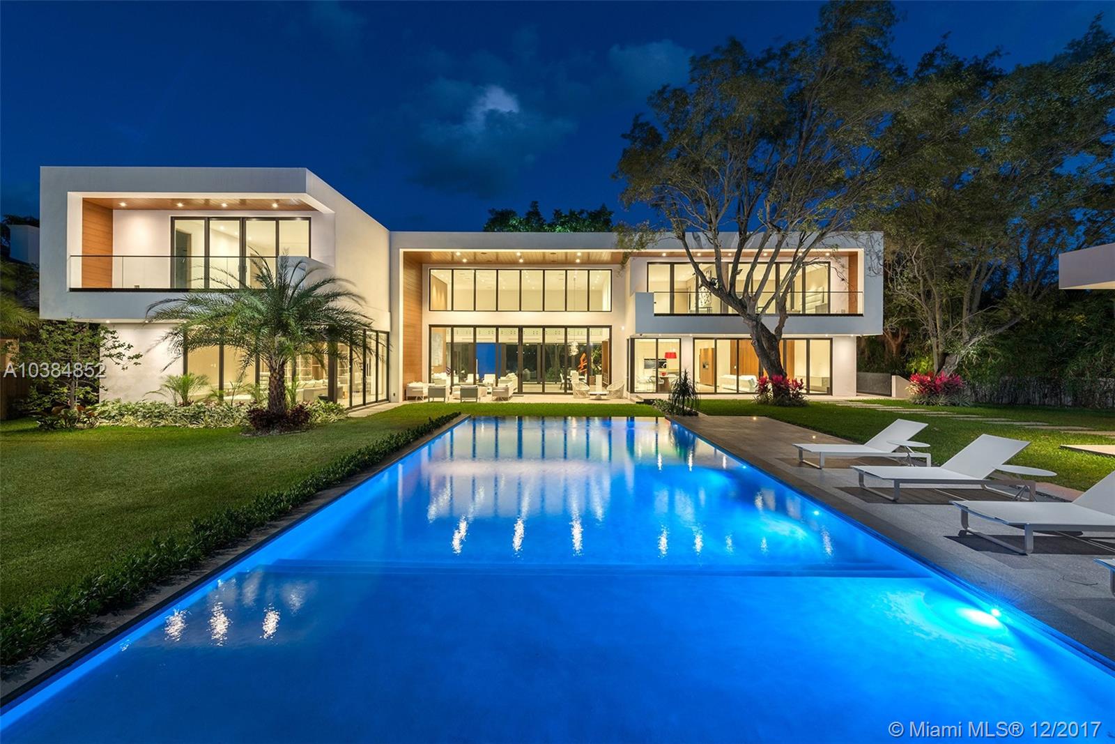 Designed with the art collector in mind, this .70-acre “smart” estate integrates the tropical landscaping of Coconut Grove with a modern architectural design that curates an environment where one can live an exceptional lifestyle. With 24-foot ceilings, floor-to-ceiling glass windows, stainless steel state-of-the-art appliances, marble/wood flooring throughout, a 10ft wine cellar, an infinity edge pool and summer kitchen, and much more this estate sets the standard in luxury living.