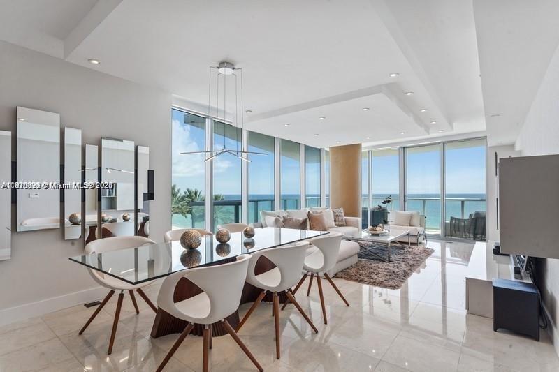 A stunning furnished corner residence with captivating ocean and city views. This 3 Bed + 3.5 Bath home features a private elevator foyer, sleek modern interiors, and an open kitchen with top-of-the-line appliances. The balcony, accessible from the living room as well as the primary and second suites, provides a comfortable space to enjoy the outdoors. The primary suite offers ample space with a walk-in closet, while all bedrooms are designed for comfort and privacy. The building offers outstanding amenities including two pools, a poolside bar, full-service spa, fitness center, 24/7 concierge, valet, and direct access to Sunny Isles’ pristine beach. A refined property where comfort meets modern luxury.
