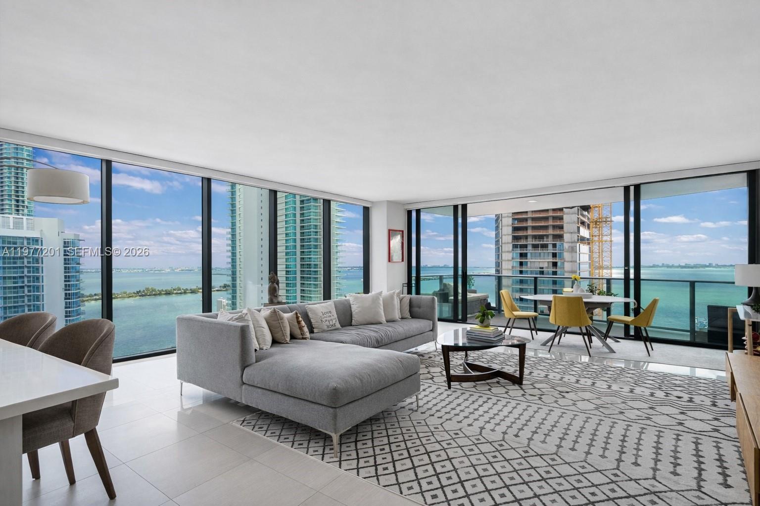 A private elevator opens directly into this bright corner residence featuring 2 bedrooms, 2 bathrooms, and a spacious Den, offering a versatile layout designed for both comfort and style. Floor-to-ceiling glass fills the home with natural light and offers breathtaking water views. The large flow-through floor plan feels open, airy, and serene, striking the perfect balance between luxury and livability. A large modern kitchen with sleek appliances and an oversized countertop with bar seating opens beautifully for everyday living and effortless entertaining. Additional highlights include custom built-out closets as well as two private balconies where you can enjoy both sunrise and sunset skies. Adding to the home’s appeal, both bathrooms feature exterior windows that bring in natural light and beautiful views. This residence offers a sense of privacy and calm in one of Miami’s most desirable waterfront buildings. Icon Bay residents enjoy premium amenities including a Bayfront pool, tennis courts, fitness center, theater room, sauna, spa rooms, a media room, club room, 24-hour concierge, security and valet.