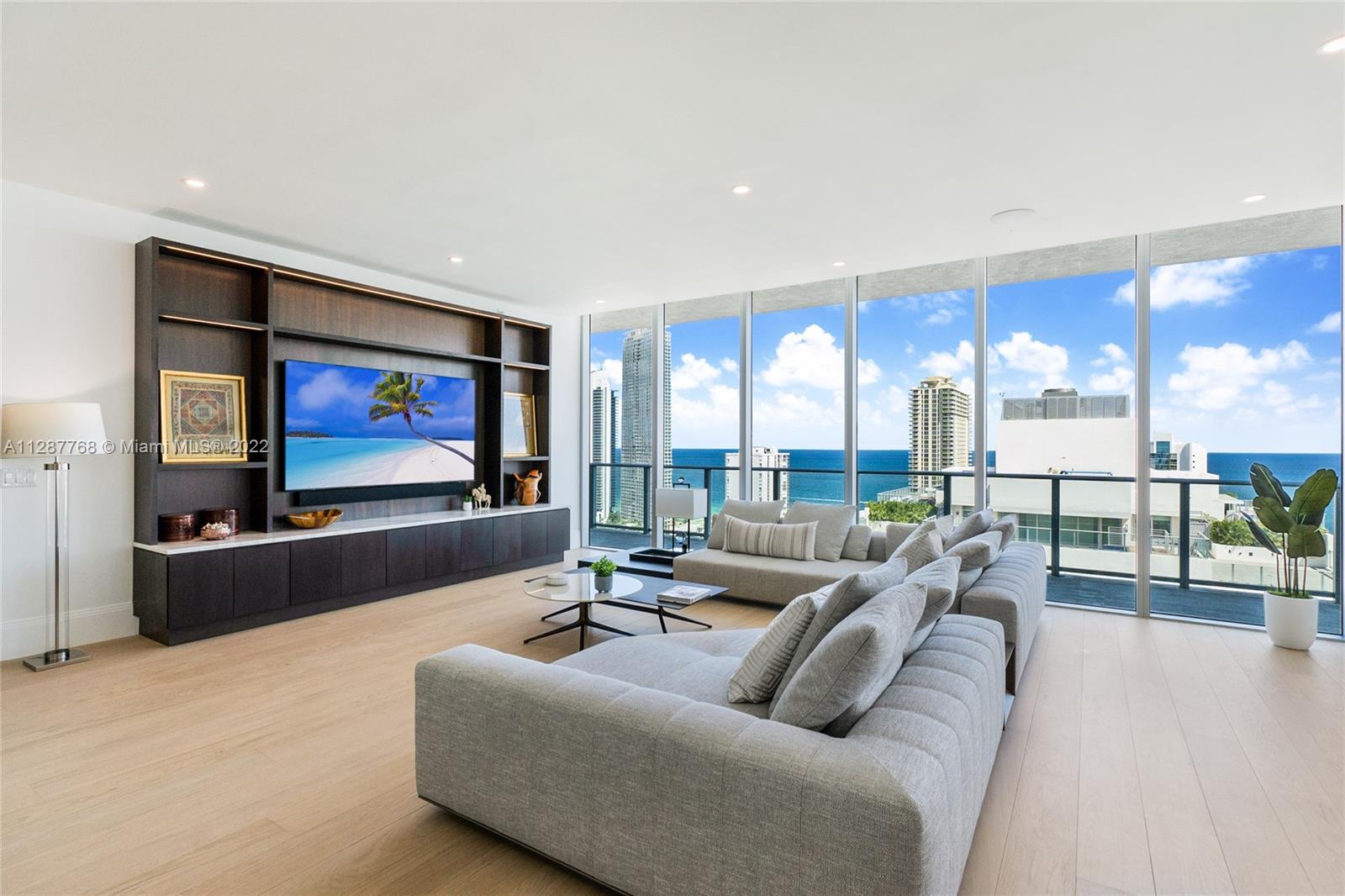 Priced to Sell! Breathtaking 2 story Tower Suite featuring open floor plan, 4 bedrooms and 6 baths & family room (easily converted back to 5 bedrooms), 4900 sq ft interior plus 4250 sf of wrap-around balconies & rooftop terrace with summer kitchen & private pool. The interior features designer finishes & furnishings, gourmet kitchen, Bosch & Sub Zero appliances & endless water views.  Walking distance to Marina & dry docks. 5 mins from the Haulover inlet w/ no fixed bridges. Includes two assigned parking spaces, two complimentary valet and & storage unit. Can be rented for a min. of 30 days, 2 times a year. Amenities include pool, spa, jacuzzi, sauna, gym, kid's room, club room, theater, game room, guest suites, residents lounge & bark park. Free membership to beach club included.