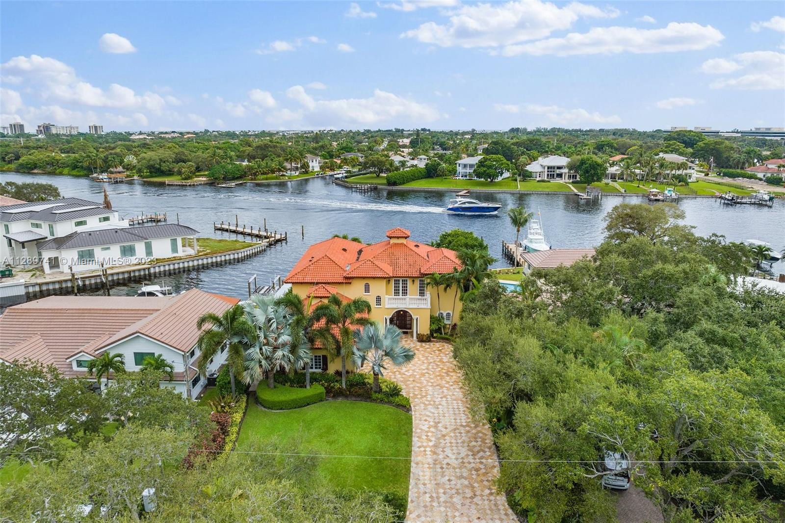 Boaters Paradise: deep water, no fixed bridges, no wake zone, between Jupiter Inlet and Lake Worth Inlets, as close as you can get to the Bahamas.  Wide water views from every bedroom.  Saturnia marble floors, Brazilian cherry flooring, faux finishing, crown molding & high ceilings throughout. A true chef's kitchen with 48" Jenn air fridge & granite counters. All bedrooms are ensuite. Balcony runs the entire second floor with access to each bedroom. Two car lifts hold five cars in a/c garage. Travertine driveway & pool terraces. Oversized covered loggia & pebble-tec salt water pool & spa make this property an entertainers dream. Built in Wine closet. Mature landscaping. New 25,000 lb boat lift with underwater dock lights. One of the most premier lots on the intracoastal. No HOA.