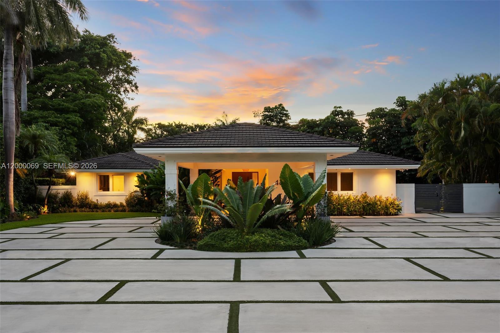 Welcome to Casa Marinella, fully renovated masterpiece on an oversized 18,731 Sqft lot in a quiet cul-de-sac within the exclusive, gated Bay Point community. This one-story home offers over 3,500 Sqft of refined interiors w a split floor plan, Italian slate and terrazzo flooring, impact windows, floor-to-ceiling doors, and a Savant smart home system. Custom features include TV wall units, wooden paneling, and designer wallpaper. The kitchen boasts custom cabinets and quartzite countertops. Luxurious bathrooms feature natural materials. Additional upgrades include motorized shades, exterior cameras, and whole-house water filtration. The outdoor space includes a summer kitchen, cabana bath, saltwater pool, jacuzzi, and lush landscaping w fruit trees. Seller financing available with 60% down.
