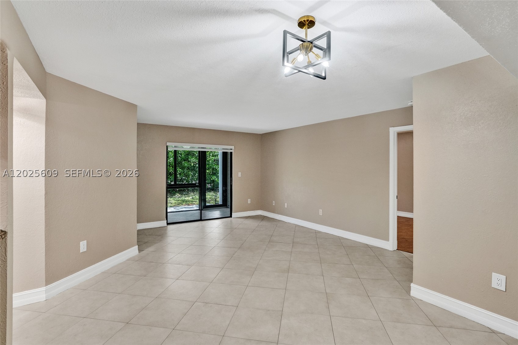 Welcome home to this beautifully maintained 2-bedroom, 2-bath ground-floor condo in the highly desirable, 24/7 guard-gated Carmel at California Club! Step inside to a bright, open layout with tile floors throughout the main living areas, a spacious living/dining combo, and an updated kitchen featuring rich wood cabinetry, gleaming granite countertops, decorative stone backsplash, and a full stainless steel appliance package, range, microwave, dishwasher, and a large French-door refrigerator. The breakfast bar is perfect for casual mornings or entertaining, while the built-in wine display adds a touch of elegance. Both bedrooms offer generous closet space, with the primary suite featuring an en-suite bath and room for a king-sized setup. Step out to your private screened lanai and enjoy your morning coffee surrounded by lush tropical landscaping and the shade of a flowering Royal Poinciana, your own slice of South Florida paradise. Additional highlights include in-unit washer/dryer, ample storage, ceiling fans, modern light fixtures, and an assigned parking spot. The community offers a sparkling pool, clubhouse, and beautifully landscaped grounds. Just minutes to Aventura Mall, Hard Rock Stadium, Sunny Isles & Hollywood Beach, I-95, and the Turnpike, with top-rated schools and endless dining and shopping nearby. Whether you're a first-time buyer, investor, or downsizing, this turn-key gem checks every box. Schedule your private tour today. Seller Financing Available