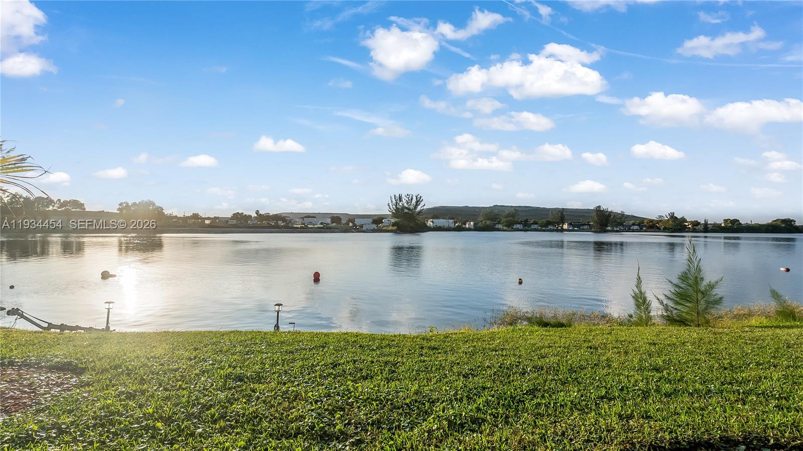 HA/VA approved fee-simple waterfront townhome tucked inside the desirable San Briana at Crystal Lake community in Deerfield Beach. This well-laid-out residence offers 2 bedrooms, 2.5 baths, and an attached one-car garage, blending comfort with everyday practicality. The main level features an open-concept kitchen flowing seamlessly into the dining and living areas, all oriented to the water and framed by full lake views and incredible sunset skies. Upstairs, both bedrooms are generously sized with ample closet space and private baths. A brand-new metal roof adds long-term value and peace of mind, and the HOA covers the roof and exterior, making ownership truly low-maintenance. Access to the lake is directly in front of the unit, allowing you to enjoy true lakefront living, park your jet skis or small boat, or head out for kayaking, canoeing, paddleboarding, or boating at a moment’s notice. The community features a heated pool and hot tub, plus access to 60-acre Crystal Lake, known for jet skiing and water sports. Ideally located near major highways, shopping, dining, and business centers, this home delivers a rare blend of waterfront lifestyle, convenience, and ease of ownership.