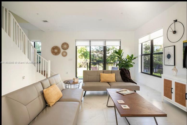 Stunning corner modern townhouse has everything you're looking for!. 
Spacious flow-thought layout with 10' ft ceilings, ceramic flooring and natural light throughout. On the first floor you'll find stainless steel appliances, kitchen island, modern cabinetry, half bath and modern decor. On the second floor a 3 bedroom split layout welcomes you, along a full equipment laundry, tittle flooring, LED bathroom mirrors, balcony, lagoon views and lots of space. This previous townhouse is located minutes from the Guitar Hard Rock Hotel, national parks, grocery stories, Aventura mall and 20 minutes from the beach. This home wont last!