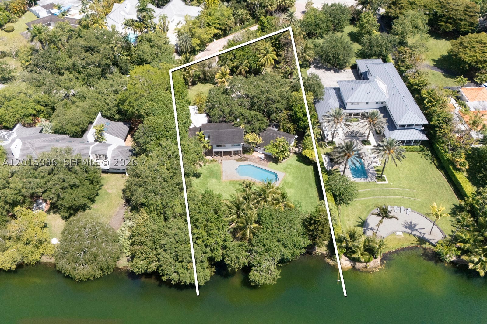 Hammock Lakefront opportunity !   Rarely available deep acre property beyond the guard gate in Banyan Estates with 147 foot southeast frontage on Hammock Lake 2.  Gorgeous lot offers peace and serenity but near everything for convenience.  .95 acre with existing 5 Br/4.5 bath 2-story charming pool home can be lived in, remodeled, or torn down for your dream home.    All Pinecrest schools in Coral Gables.