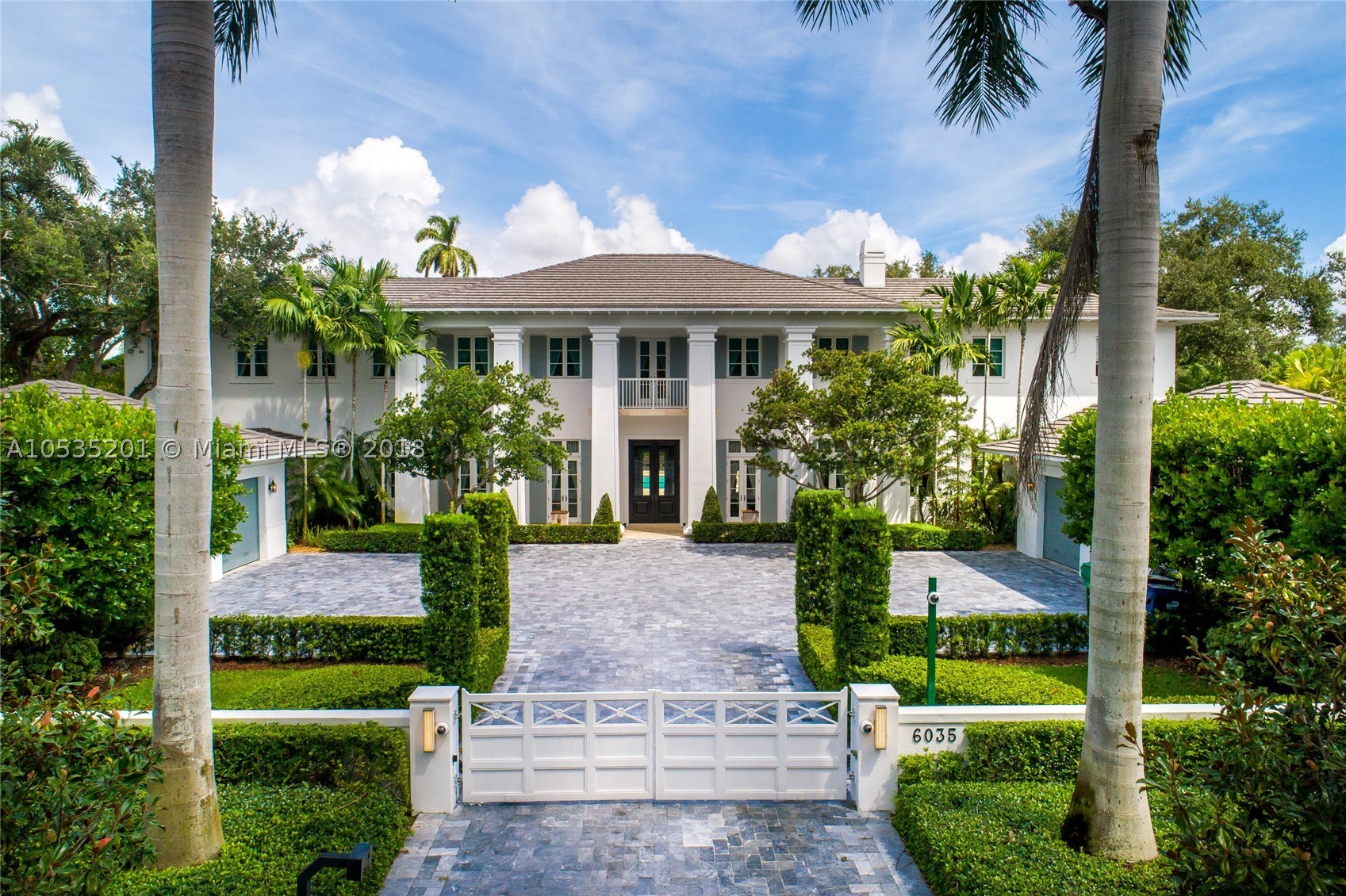 This stunning, North Pinecrest home lies nestled on a lush, oak filled one + acre lot. A spectacular estate w gym, media room and large home office/library. Impeccably designed for entertaining inside & out, enjoy an outdoor kitchen, gazebo and covered terrace. Awing interior with huge windows, wood floors, refined finishes & details. Formal living and dining room, a gorgeous chef’s kitchen w Viking appliances, oversized pantry is a Chef’s dream.  Four car garage & detached guesthouse add to the allure.