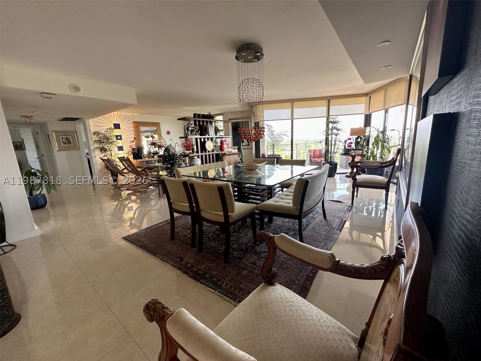 Experience refined waterfront living from this exceptional 11th-floor corner residence in Tower 1 at Quayside. Spanning 1,913 square feet, this sophisticated home is filled with natural light and showcases sweeping views of Biscayne Bay, the Miami skyline, and lush tropical surroundings through expansive floor-to-ceiling glass. Currently configured as a spacious 2-bedroom, 2.5-bath layout with an enlarged living area, it offers a grand, open-concept feel. The original 3-bedroom floor plan can be easily restored.
Beautifully updated, the interiors feature large-format porcelain flooring, a sleek modern kitchen with stainless steel appliances, granite countertops, contemporary cabinetry, and renovated baths. The primary suite offers a serene retreat with generous proportions, abundant light, and a spa-like bath. A private terrace invites you to enjoy sunrise skies, sparkling city lights, and tranquil bay breezes. Two assigned parking spaces add rare convenience and value.
Set within Quayside, one of Miami’s most established private waterfront enclaves, residents enjoy a resort-inspired lifestyle across 33 gated acres with amenities including marina access, tennis and pickleball courts, fitness center and spa, pool, jacuzzi, steam room, on-site dining, landscaped grounds, and 24/7 security. Ideally located minutes from Miami Beach, Downtown, Brickell, and the Design District. A rare opportunity to own a spacious waterfront residence with captivating views and lifestyle​​‌​​​​‌​‌​​​‌‌​​​‌‌‌​​‌​​‌‌​​​​ appeal.