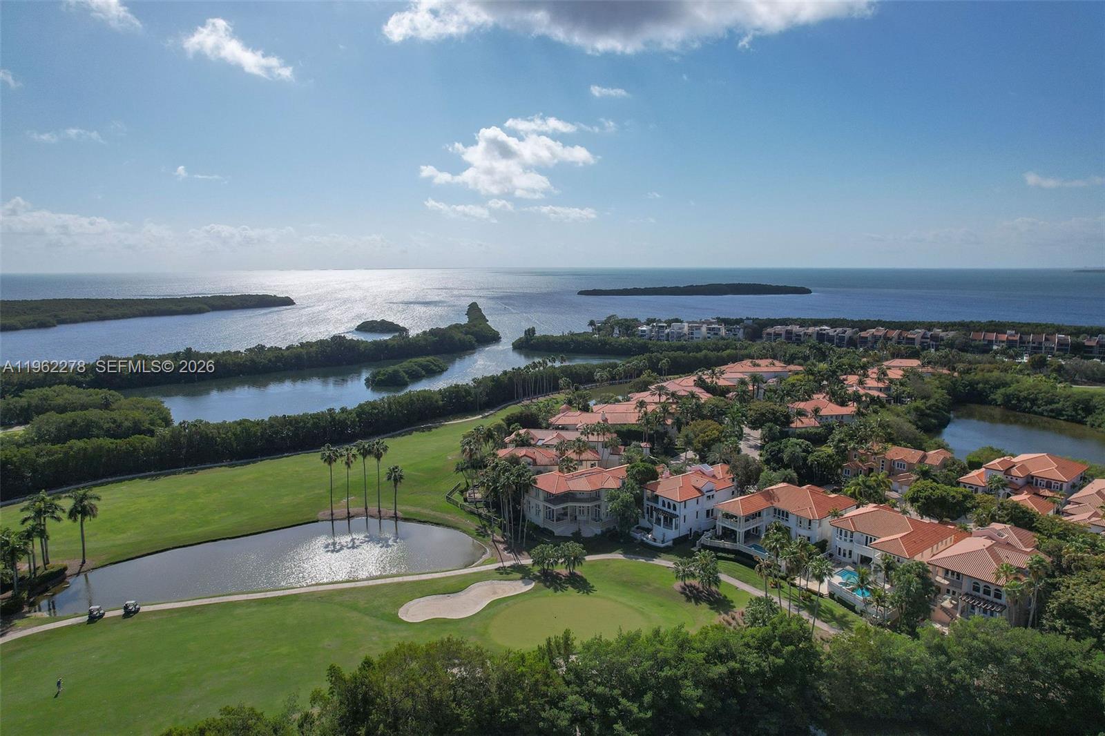 Nestled within the exclusive Estates at Deering Bay, this custom-built residence offers timeless elegance, exceptional craftsmanship, & resort style living within one of Coral Gables' most prestigious gated communities.

Custom home finishes reflect exceptional quality: solid core wood doors, custom millwork, tray ceilings, double crown moldings, wrought-iron spiral staircase, & a seamless blend of marble & hardwood flooring throughout.

The thoughtfully designed floorplan features 5 bedrooms, 6 full bathrooms, & 3 half bathrooms, complemented by multiple flex spaces, including private dens, office, & flexible rooms ideal for today’s lifestyle. The chef’s kitchen is equipped with paneled Viking refrigeration, Viking gas range with double oven, copper farmhouse sinks, honed travertine countertops, & a secondary island with mini fridge.

Outdoors, enjoy a gated backyard with mature fruit trees, summer kitchen, outdoor dining, & private golf course views. Additional highlights include a full-house generator, elevator, built-in speakers, mosquito misting system, & 26 camera security system.

Residents enjoy Deering Bay’s world-class amenities across 220 acres, including Arnold Palmer golf, marinas, tennis, pickleball,  fitness center, clubhouse dining, & 24-hour gated security. Two associations govern the property with landscaping included.