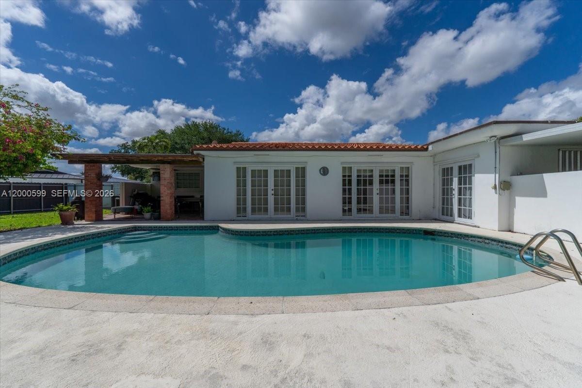 No HOA! No restrictions! Prime location. 4-bedroom, 3-bath home with pool and great potential -perfect for investors or end-users looking to customize and make it their own dream home. Features two master bedrooms plus two additional bedrooms. Enjoy a lush backyard with mango, lychee, two avocado trees, moringa tree, and sour orange.