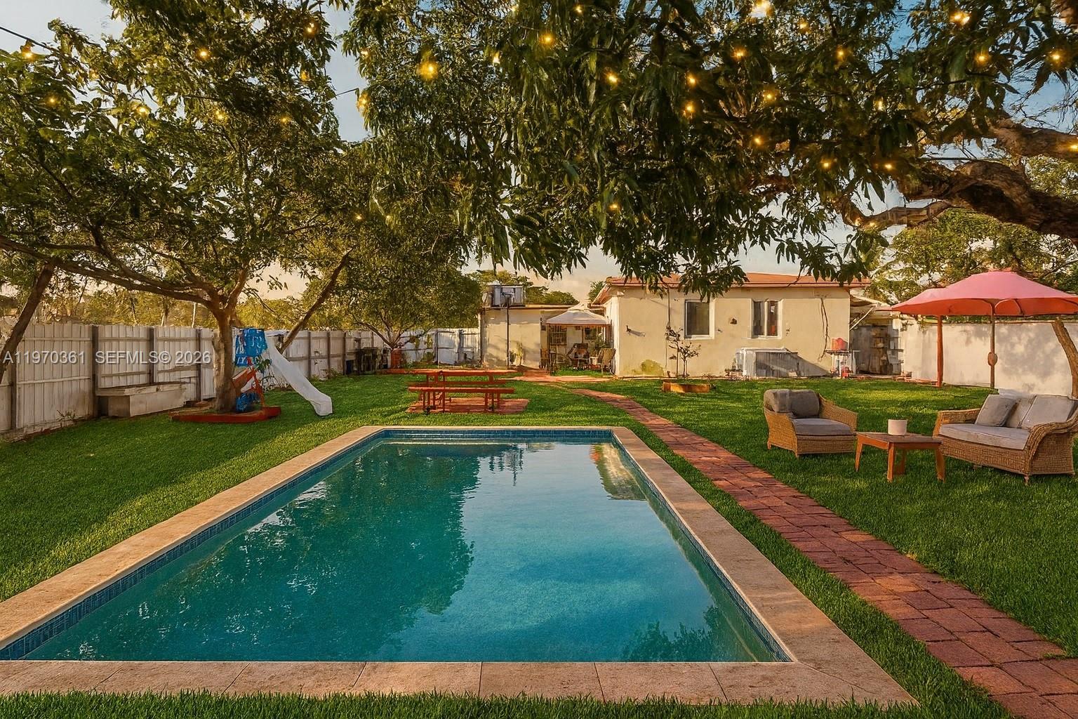 WELCOME to North Miami Gem with Unlimited Potential! This charming 3-bedroom, 1-bathroom corner home, with a plus, offers a bright and functional living space, perfect for families or investors. Safety and efficiency are top priorities here, as the home comes fully equipped with high-impact doors. New 2021 AC unit and complete duct replacement. Roof is 2011, full replacement with high expectancy shingles. Step outside into your private tropical oasis—a massive, fully 2024 fenced backyard featuring mature fruit trees, a large patio for entertaining, and a convenient storage shed. With a lot of this size, there is plenty of room to build the pool of your dreams and / store all your toys! Centrally located near major highways, shopping, and dining, this home offers the perfect balance of suburban peace and city convenience. Move-in ready and waiting for your personal touch! Some photos have been staged to show the potential of this property.