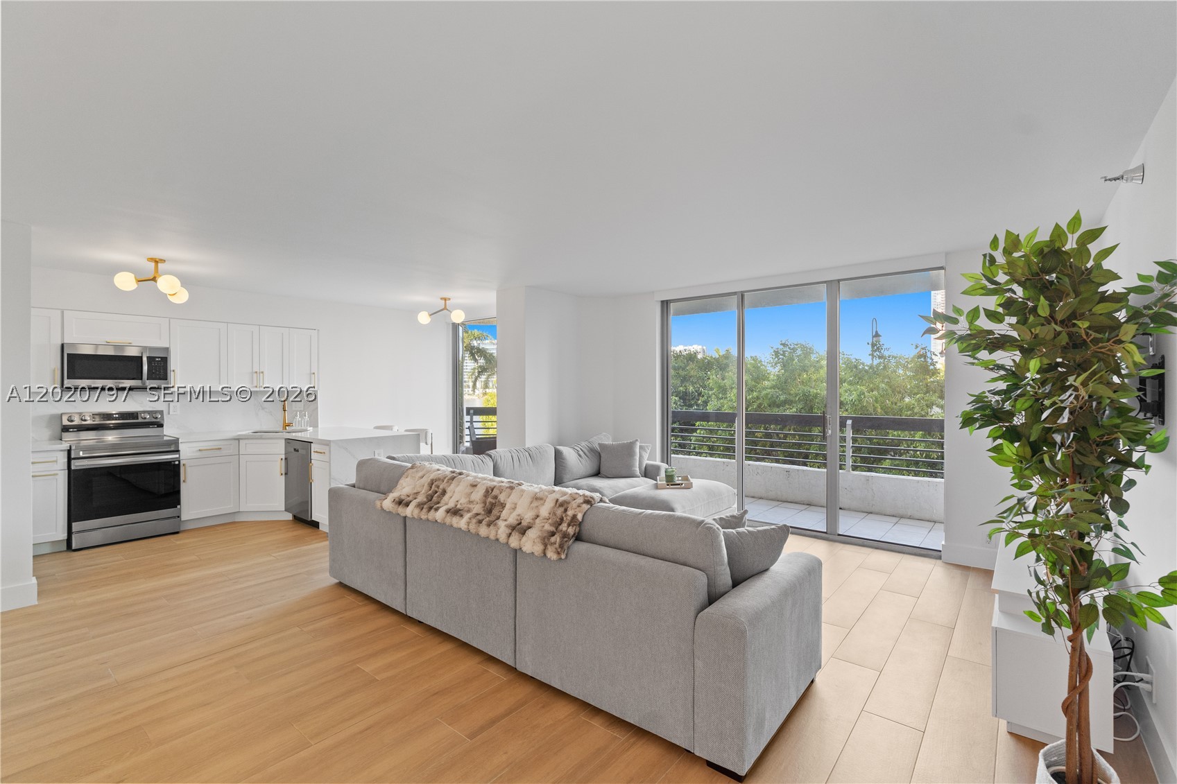 Beautifully reimagined condo featuring sophisticated contemporary design and exceptional curated craftsmanship. This turnkey property showcases beautiful tile floors, smooth ceilings, and premium-quality finishes. The exceptional floorplan features two spacious primary bedrooms with en-suite bathrooms and custom designed walk-in closets. A unique third bathroom creates an ideal layout for guests or enhanced privacy. Seamlessly integrated open-concept kitchen designed for everyday living and entertaining features quartz countertops, abundant storage, and brand-new appliances covered by a 5-year warranty. Elegant custom LED lighting throughout the residence. The remodeled bathrooms include engineered stone vanities, Toto toilets, custom-designed showers with frameless glass, smart mirrors and designer fixtures. Additional upgrades include filtered blinds, updated A/C vents, a dedicated shoe closet, in-unit laundry, and a 2023 A/C system & water heater. Every detail of this residence was thoughtfully designed to deliver a luxurious, move-in-ready living experience with timeless finishes, exceptional functionality, and modern elegance throughout. Mystic Pointe offers a resort lifestyle with amenities such as pool, fitness, sauna, jacuzzi, tennis & pickleball, dog park, valet, EV stations, an on-site restaurant, and 24/7 security. Located just minutes from Aventura Mall, beaches, and houses of worship, this residence delivers refined waterfront living with unmatched convenience.