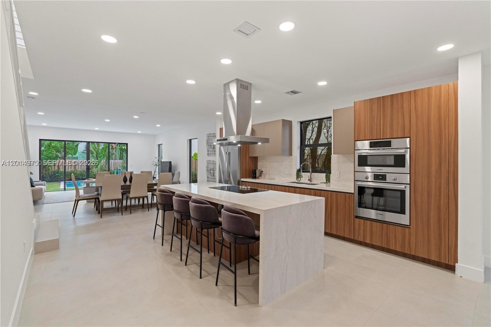 Step inside the best-priced new construction 4-bedroom townhome in Victoria Park.
Designed to exceed expectations, this stunning residence features an open layout with elevated ceilings, a chef’s kitchen outfitted with Bosch appliances, seamlessly flowing into the living and dining areas, a 1-car garage, fenced backyard, private pool, and summer kitchen hookup—perfect for entertaining.

Ideally located near Las Olas, the beach, and steps from Holiday Park, with no rental restrictions making it an exceptional opportunity for homeowners, investors, or a 1031 exchange.