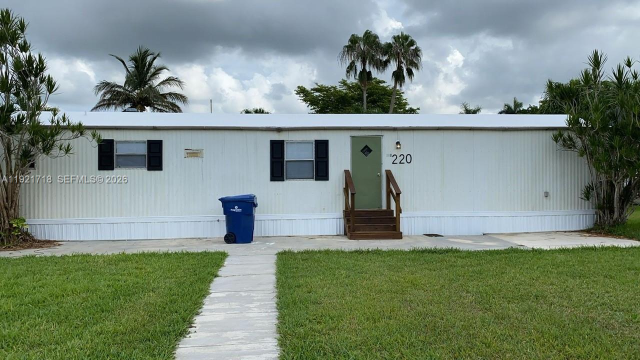 Beautifully remodeled 1 year ago.  This  3/2 bath mobile home is waiting for you. Quaint in size but delivers comfort with a punch.  Large living area concept, separate laundry area, split bedroom plan, master with bathroom on one side and jack & jill bathroom with 2 bedrooms on the other side.  House has appliances, washer, dryer, stove, microwave, refridgerator, dishwasher, with pantry cabinet. Good storage, including an outdoor shed for extra storage. Bathrooms have tile floors, house has vinyl planks flooring.  Huge lot over 5200 sqft with large front yard that can be fenced for privacy. 2 assigned parking spaces right in front of your yard with additional guest parking spaces in the neighborhood. Community is Gateway Estates Park, just 20 minutes to Key Largo.  The neighborhood is fenced with gate access, has pool, club house, lakes and children's play area. 
Excellent value for retirees, or first time buyers.  Owner will finance with only 10% down payment and excellent terms. Vacant and ready to show!! Best of all you own your land and the assoc. dues are only $174.00 per month.