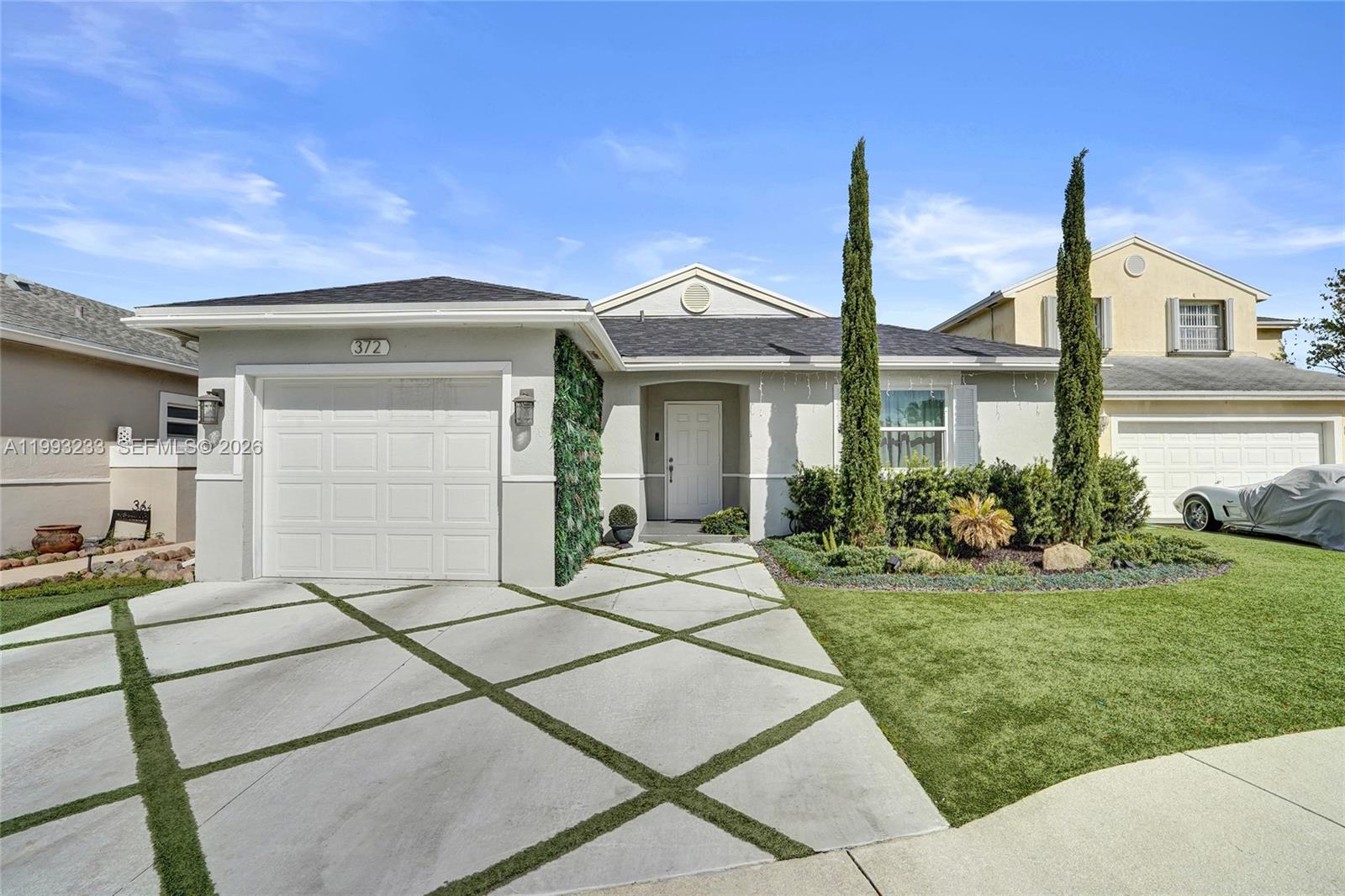 Beautifully remodeled single-family home featuring 3 bedrooms plus a versatile additional room that can easily serve as a 4th bedroom, home office, or guest space, along with 2 updated bathrooms. This home offers a bright and open layout with high ceilings in the family and dining areas, creating a spacious and inviting atmosphere.

Tastefully upgraded throughout with modern flooring, a fully renovated kitchen, and stylishly updated bathrooms. The home has undergone significant improvements, enhancing both comfort and functionality.

The outdoor spaces have been thoughtfully designed with elegant artificial turf landscaping, creating a low-maintenance yet visually appealing environment. Enjoy a charming and private backyard, complete with decorative greenery panels and a convenient storage shed, perfect for relaxing or entertaining.

This property features a covered one-car garage with automatic door plus driveway space for up to 2 additional vehicles, providing excellent parking flexibility.

Located in a desirable community offering amenities including a pool, jacuzzi, and playground, and ideally positioned directly across from Oscar Wind Park and the scenic Sawgrass Sanctuary, perfect for walking, exercising, and enjoying nature.

Prime location just minutes from major highways (I-595, I-75, Sawgrass Expressway) and world-class shopping at Sawgrass Mills Mall, as well as dining and top-rated Weston schools.
