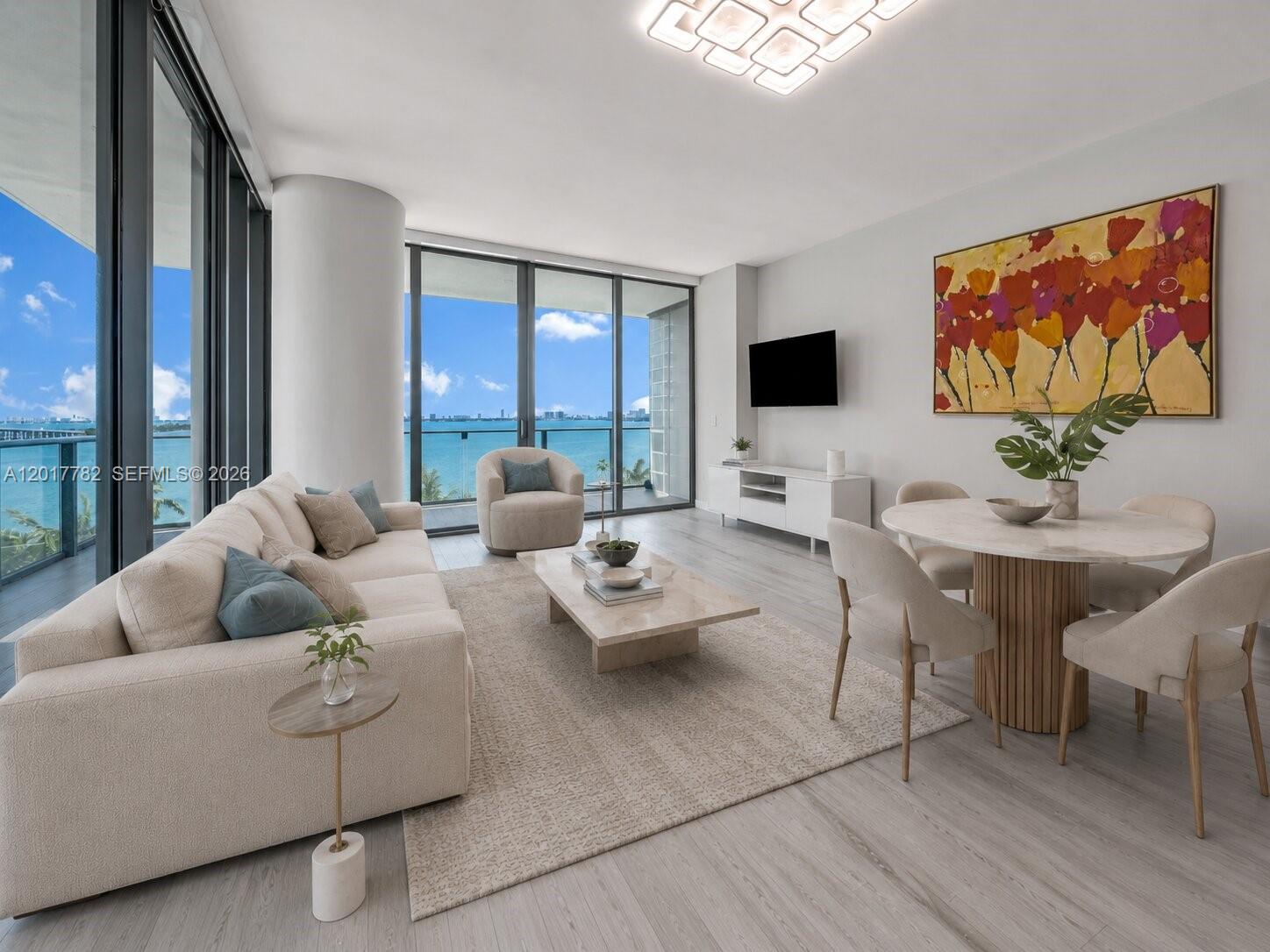 Spectacular 3BD/3BA + oversized den move-in ready corner residence in the heart of Edgewater with an enormous wraparound balcony showcasing stunning bay and city views. Ideally located just minutes from Wynwood, the Design District, Midtown, Brickell, and Miami Beach, offering the ultimate Miami lifestyle with world-class dining, shopping, and entertainment nearby. This bright and modern unit features a spacious open layout and has been extensively upgraded with custom-made interior doors, fully built-out closets in all bedrooms, designer wallpaper accents, tile flooring throughout, motorized shades with blackout shades in bedrooms, and a custom-built pantry providing exceptional additional storage. The primary suite has been tastefully enhanced with elegant custom finishes. Enjoy resort-style living with Gran Paraiso’s world-class amenities including a waterfront pool, tennis courts, state-of-the-art fitness center, spa, sauna, wine room, social lounges, valet, concierge, and 24-hour security. *Includes 2 assigned parking spaces and an oversized storage unit*