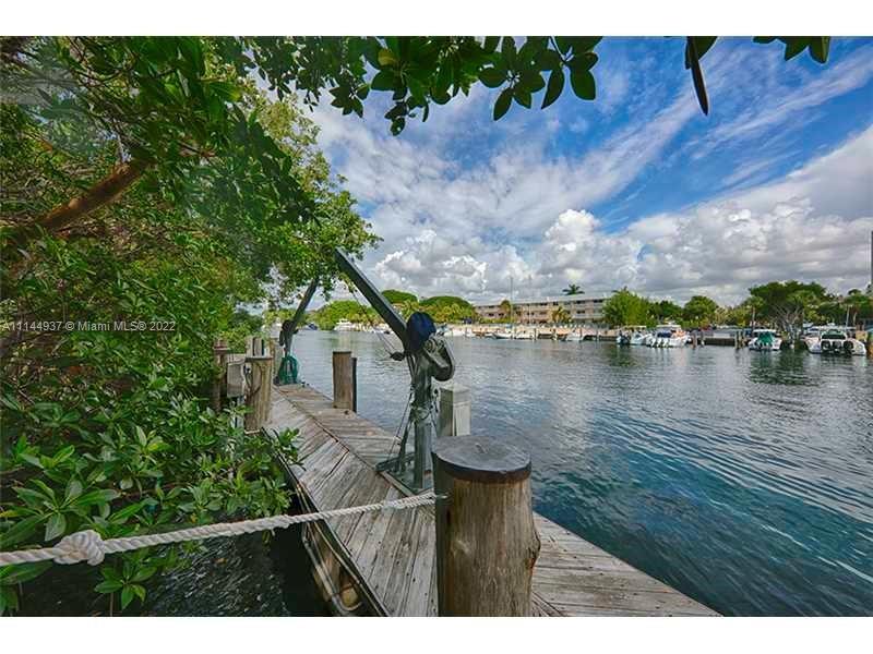 No Bridge to Bay! Wide waterway, oversized 22,723SF lot in beautiful Marina Section of Islands of Cocoplum, offering world-class amenities. Sold AS-IS w Plans (in approval process) for Home set far back from the street on private cul de sac. Plans by Renowned architect Eduardo Calil (French Contemporary Style) for 6/6/1 + playroom/office & media w over 10,559SF featuring Large open spaces w great flow to covered terraces, garden, pool deck, & dock. Fabulous upstairs master wing w spacious walk-in closets, vault room, glamorous spa bath, & front & back private covered terraces. 3 additional upstairs suites w walk-in closets and terraces. Downstairs guest bedroom, additional multi-staff quarters, & utility room. Great opportunity to build to your liking on an oversized No Bridge to Bay lot!
