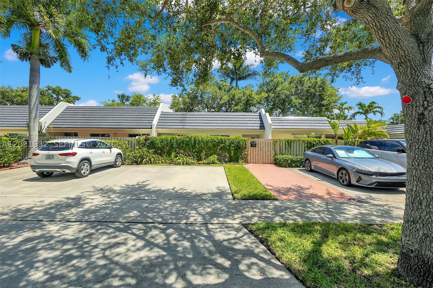 Completely renovated and move-in ready, this rare one-story waterfront townhouse in highly desirable Kings Creek offers modern updates, comfort, and an unbeatable location. The sought-after "J" model features an open floor plan with a courtyard entry, foyer, ceramic tile flooring throughout, and a split-bedroom layout. Recent upgrades include a newer roof, newer water heater, renovated kitchen, updated bathrooms, and stylish finishes throughout. The spacious primary suite overlooks the screened patio and tranquil Snapper Creek Canal. Enjoy serene waterfront living with lush landscaping, accordion hurricane shutters, and a private dock equipped with water and electricity. Conveniently located minutes from Downtown Dadeland, Baptist Hospital, Metrorail, the University of Miami, shopping, dining, and major highways. Low HOA fee of just $235/month includes community amenities. Rare waterfront opportunity!