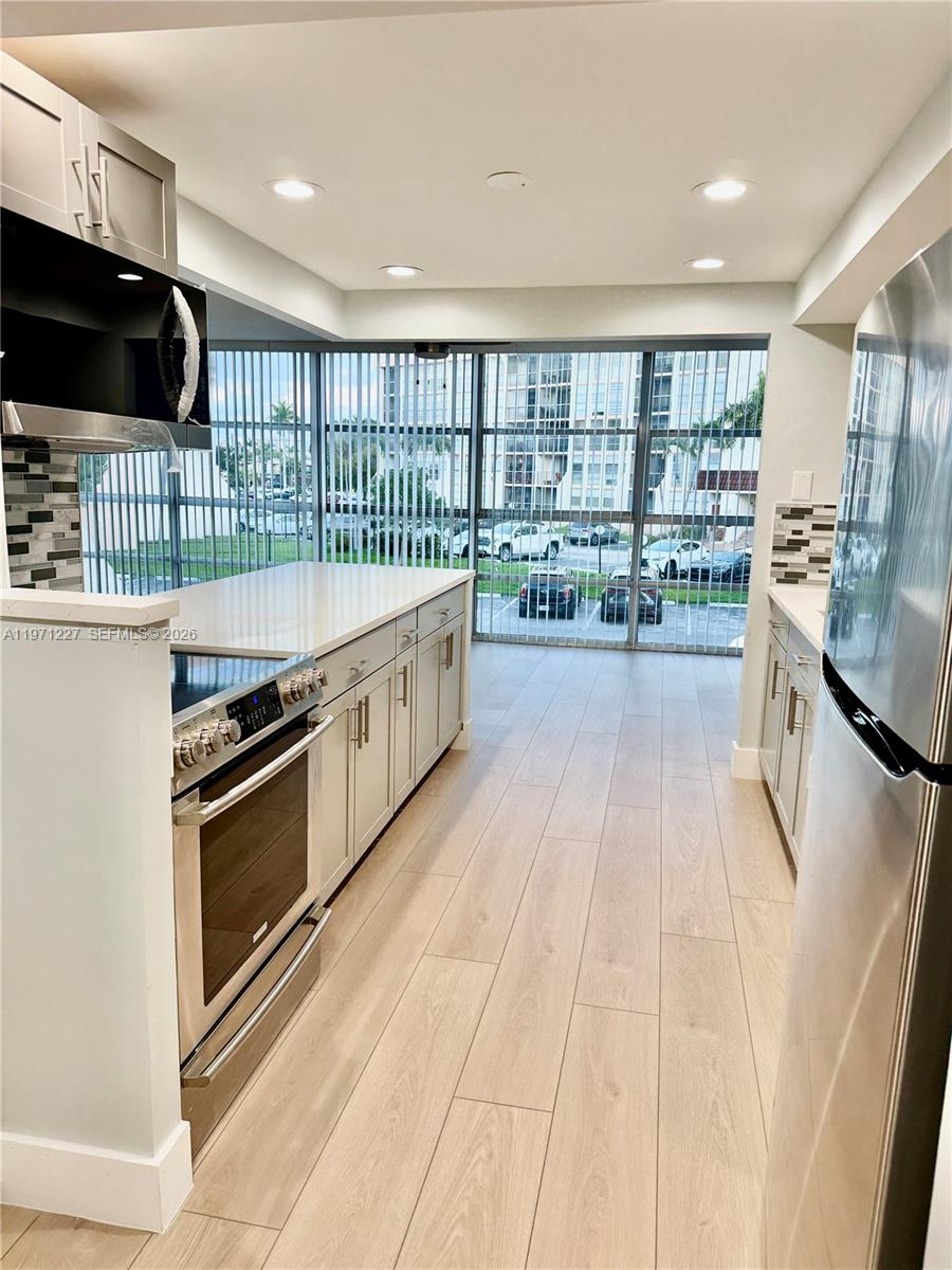 Beautiful REMODELED property located in the desirable Three Islands community in Hallandale Beach. This remarkable apartment features a spacious layout with two private balconies, spacious bedrooms,a modern remodeled kitchen, NEW SS appliances, beautiful countertops, NEW flooring, ample closet space, and spacious bathrooms. Filled with natural light.. Location, location!! Close to the beach and shops. Come to this vibrant community. Take this opportunity!!add your personal touch and make it YOUR HOME SWEET HOME!!