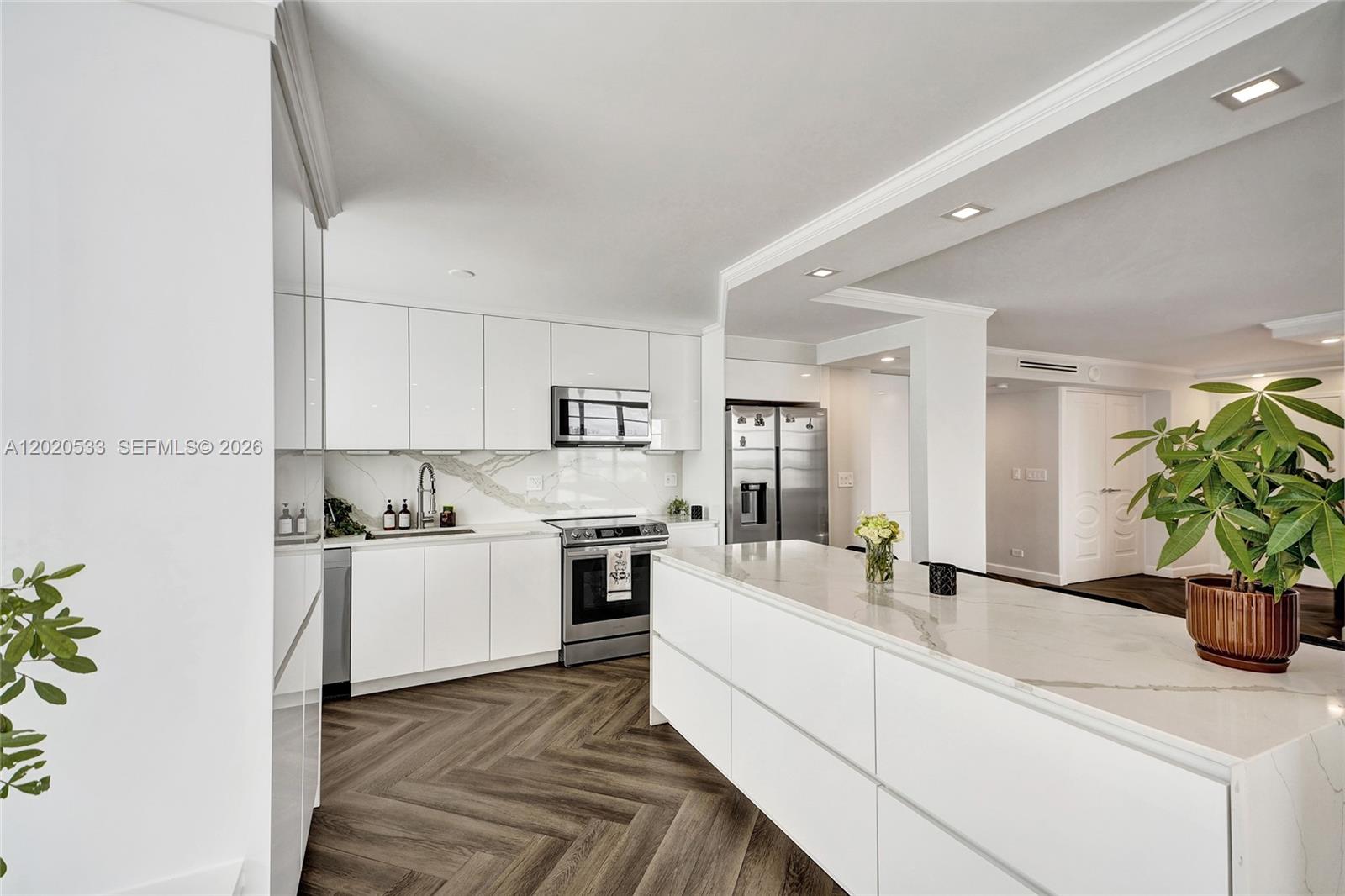 Largest 2BD/2BA corner unit in Winston Towers with rare 2 parking spaces, high-floor positioning, and endless panoramic Ocean, Intracoastal, and city views in the heart of Sunny Isles Beach! This spacious 1,552 SF residence plus large wraparound terrace is filled with natural light and offers the perfect layout for coastal living. Features include fresh paint, custom cabinetry throughout, beautiful LED lighting, top-of-the-line A/C vents, and NEW stainless steel dishwasher, microwave, and stove. Walk to the beach directly across the street. Amenities include social room with billiards, large gym, and pool. HOA includes internet, cable, hot water, HVAC, and minor appliance repair. Washer/dryer on floor. No-pet building. Leasing allowed after 1 year; minimum 1-year lease. Building is financeable and has completed its 50-year certification. Excellent opportunity for space, views, location, and 2 parking spaces!
All information deemed reliable but must be verified by buyer/buyer’s agent. Listing agent not responsible for errors or omissions.