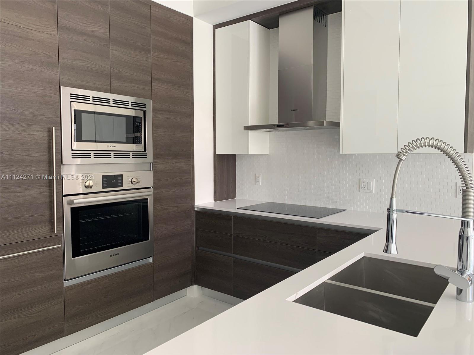 Brand new construction. This penthouse apartment features a modern feel, as you can see in the pictures. Fully equipped kitchen and laundry; all BOSH appliances included. Great place to own, since it is in the heart of Coral Gables. May also be rented, since it is OK to Lease. Expansive view of the city, and situated near Shops at Merrick Manor, the Miracle Mile, FAIRCHILD TROPICAL BOTANICAL GARDEN, Matheson Hammock Park, and more. Unique to these apartments, this one features TWO PARKING SPACES in the covered garage. Furthermore, the building includes beautiful amenities: pool deck with barbecue area, fully equipped gym, and News cafe & Lounge.