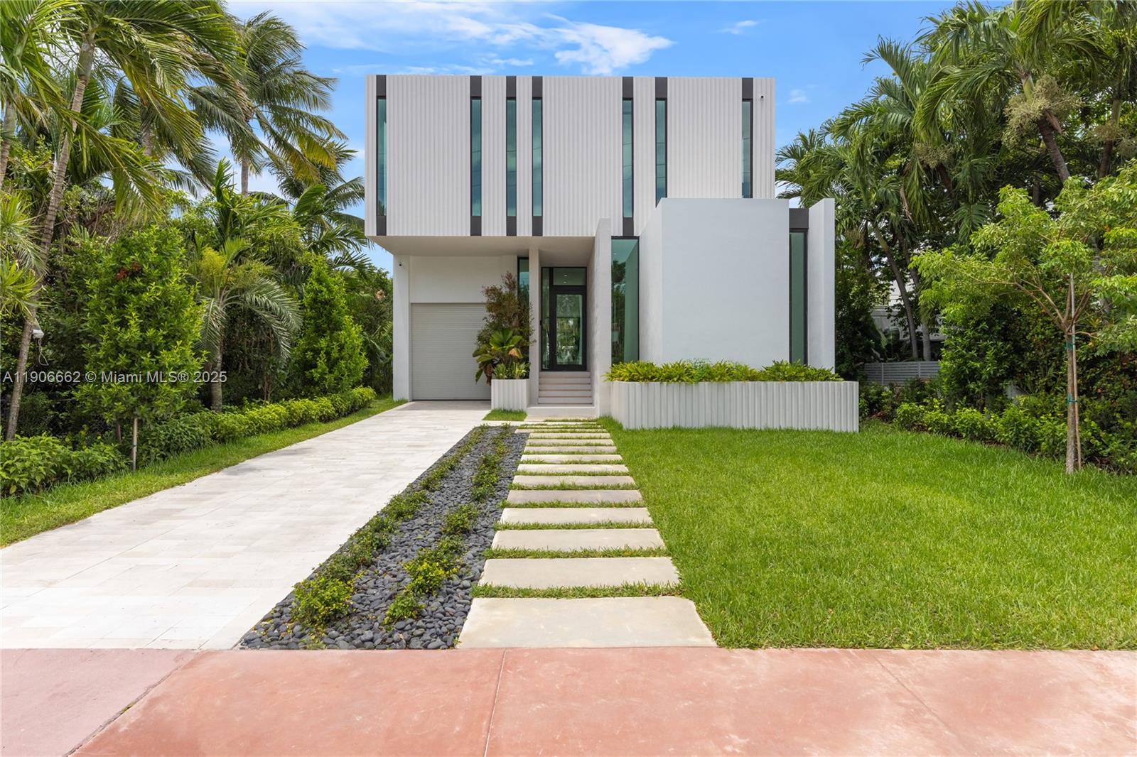 Located in the heart of Miami Beach, this brand-new modern masterpiece offers nearly 4,000 square feet of refined living space with 5 bedrooms and 6 bathrooms. A serene courtyard welcomes you into a home defined by clean lines, natural light, and sophisticated design. The grand marble staircase serves as a striking centerpiece, leading to the upper-level primary suite with walk-in closets and a beautifully designed bathroom.

A convenient first-floor bedroom with a full bathroom is ideal for guests or a private office. Outside, the inviting pool area and fully equipped summer kitchen create the perfect setting for entertaining or relaxing under the Miami sun. Every detail of this residence blends elegance, efficiency, and architectural distinction for a truly elevated lifestyle.