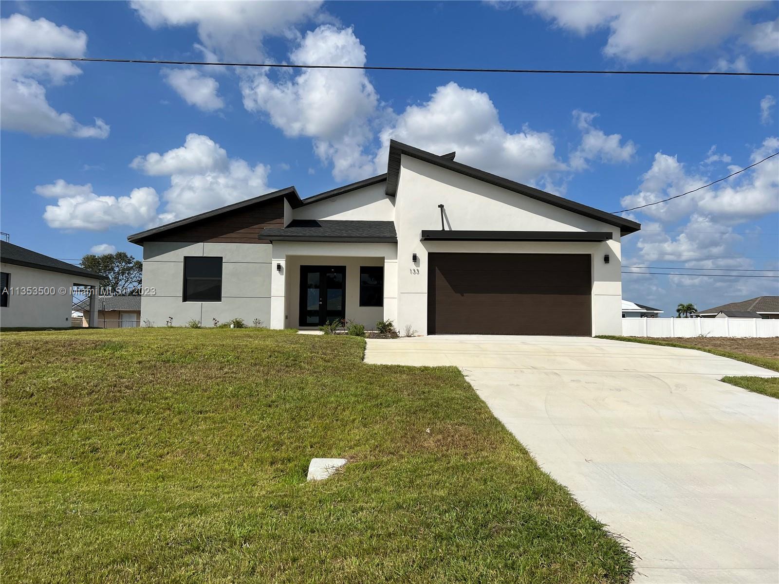 Welcome to this brand new 2023 Isabelle Model 3bedroom 2 full bathroom 6 car driveway located in the heart of Cape Coral. Modern open space living room, dining room and kitchen with high end Italian cabinetry along with stainless steel smart home appliances. 10 feet high ceilings along with a Spacious master bathroom that is equipped with dual sink for his and hers included with smart lighting, enjoy a rainfall marble shower with various water spray options, Spacious! walk-in closets all around. Smart modern fans included in all bedrooms. Very spacious laundry/storage room included with washer and dryer. Big lanai with lighting and summer pavers, ready to enjoy. Minutes away from restaurants, shopping centers, retail, golf courses and more!!! Call now!!! Agent- Kevin Triana