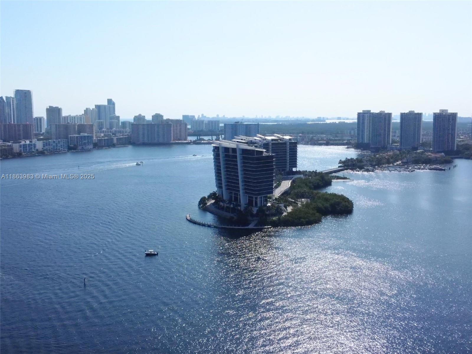 High above the marina, where the breeze carries the hush of the bay, this 2-bed, 2-bath sky retreat invites you to live surrounded by light and stillness. Watch the water shimmer from your private balcony as boats glide by and the sun paints the sky in slow motion. Play a round of tennis, take a swim by the dock, grab something quick at the convenience shop downstairs, or head to Aventura Mall just minutes away. But truthfully—you may never want to leave. Because here, the view isn’t just beautiful... it feels like a secret only you get to keep.