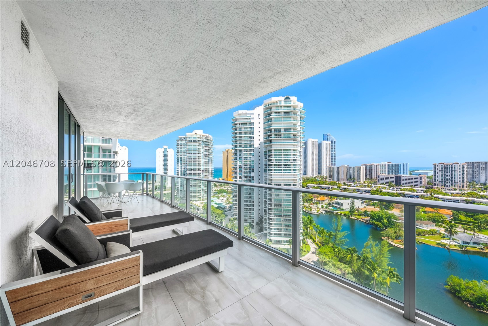 Premier High-Floor Corner Residence at Parque Towers! Offering 3 bedrooms, desirable south-facing exposure, & one of the building's most sought-after lines, this residence showcases breathtaking panoramic views of the Atlantic Ocean, Intracoastal Waterway, & Miami skyline through floor-to-ceiling impact glass & an expansive wraparound terrace designed for seamless indoor-outdoor living. 

Offered furnished with select designer pieces, including an Artefacto KADAN II sectional, glass dining set, bedroom furnishings, & select artwork, the residence is move-in ready. The spacious open-concept layout features an eat-in chef's kitchen complete with a large island, wine cooler, & premium finishes, perfect for both everyday living & entertaining. 

The luxurious primary suite serves as a private retreat, featuring 2 closets & a spa-inspired bathroom with dual vanities, a soaking tub, & a separate glass-enclosed shower. Additional highlights include a full-size washer & dryer, 2 assigned self-parking spaces, 2 valet parking spaces, & a private storage unit.

Parque Towers is a newly constructed, full-service luxury condominium in the heart of Sunny Isles Beach, offering an exceptional lifestyle with world-class amenities. Residents enjoy 24-hour concierge & valet, 4 resort-style pools, a State-of-the-Art fitness center, spa, private beach club with transportation & beach service, hotel-style guest suites, private cinema, game room, bar & bistro, & children's playground.