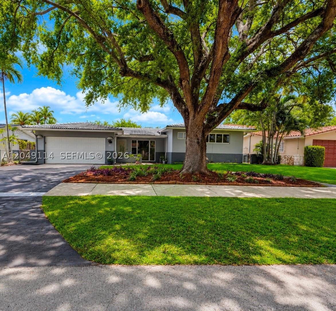 Move right into this beautifully updated 3-bedroom, 2-bath home in the heart of Miami Springs! Major upgrades include a new roof (2026), impact windows and doors, hurricane-rated garage door, new 5-ton energy-efficient A/C (2025), new pool pump, washer, dryer, microwave, and garbage disposal (2026). Features include terrazzo floors in the main living areas, wood floors in the bedrooms, updated electrical, built-in safes, a private well for irrigation, security system with Wi-Fi cameras, and solar pathway lighting. Enjoy the private backyard with a resurfaced pool and spa, plus a grandfathered rear carport large enough for an RV, boat, or multiple personal watercraft. One-car garage with workshop and utility room, rear alley access, and located in Miami Springs' desirable golf cart community near top-rated schools, parks, shopping, dining, major highways, and Miami International Airport.