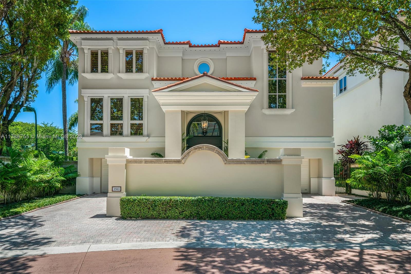 Lushly landscaped Palm Beach style 7,201 Sq Ft 3-story home with 4-BD and 5.5-BA in Coconut Grove’s gated “Bayshore Villas” waterfront enclave of 25 single family luxury homes. Features reflect the epitome of elegance and good taste, with exquisite interior millwork detail, grand entry with volume ceilings and double-height main door, elevator, and multiple covered terraces. An expansive floor plan includes a formal living room, bar area with bamboo-textured ceilings, 2 family rooms, 2 laundry rooms, spacious primary bedroom suite, elegant dining room, and gourmet eat-in kitchen with custom cabinetry, large island and top-of-the-line appliances.   Minutes from some of the best parks, schools, marinas, and restaurants in Miami. Amenities include a clubhouse, pool, and two tennis courts.