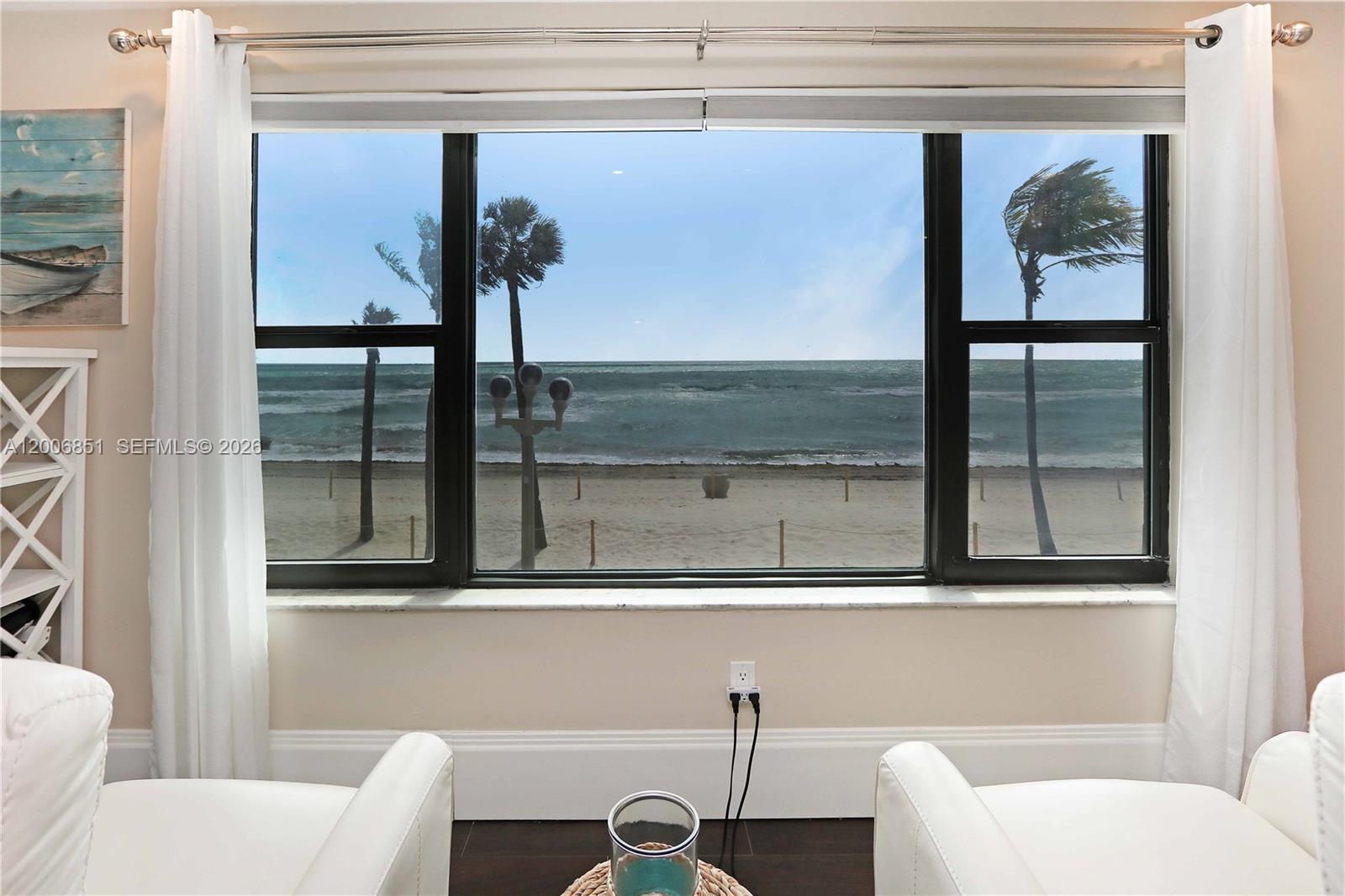 Rare opportunity to own a true oceanfront gem in a boutique building on the iconic Hollywood Broadwalk. This one-of-a-kind, second-floor penthouse corner unit offers unobstructed, direct ocean views and a private entrance staircase leading straight into the residence.
Custom-built with high-end finishes, this fully furnished, turnkey condo is designed for effortless beach living or an income-producing investment, with daily rentals permitted. The open-concept layout is enhanced by uniform tile flooring, recessed lighting, elegant tray ceilings, and high-end molding.
The kitchen features stainless steel appliances, a wall oven, sleek backsplash with marble mosaic accents at the stove, and a modern hood. Plus a spacious utility/storage room and washer/dryer hookup add convenience.
Wake up to breathtaking northeast ocean views from the bedroom’s corner windows, filling the space with natural light. The bathroom is beautifully appointed with a double sink vanity, large medicine cabinet, and a walk-in shower with mosaic tile and glass enclosure. 
Additional highlights include all impact windows and doors, new A/C, one covered assigned parking space, and a new community pool that make this the perfect weekend retreat or full-time coastal residence.
Whether you’re looking for a personal beach escape or a high-demand rental property, this exceptional oceanfront condo offers the best of both worlds in one of South Florida’s most desirable beachfront locations.