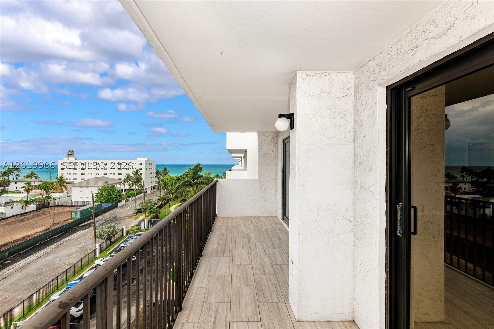 So Florida Beach Lifestyle! Step into this remodeled 2-bdm, 2-bth featuring a split floor plan w/1,570 sq. ft.  Enjoy a sleek, modern kitchen w/quartz countertops, SS appliances & plenty of cabinet space. Bathrooms w/custom vanities & frameless glass-enclosed showers, exuding spa-like elegance. Porcelain tile flooring, impact doors & windows for style & safety. In-unit washer & dryer & assigned garage parking space. Building amenities include heated swimming pools, tennis court, pickleball & basketball courts, billiard room, fully equipped gym, shuffleboard, entertainment areas and storage. Maintenance includes cable, internet & building reserves. Steps from the famous Hollywood Beach Boardwalk, restaurants, entertainment & Ft Lauderdale Intl Airport. Florida coastal living at its finest.
