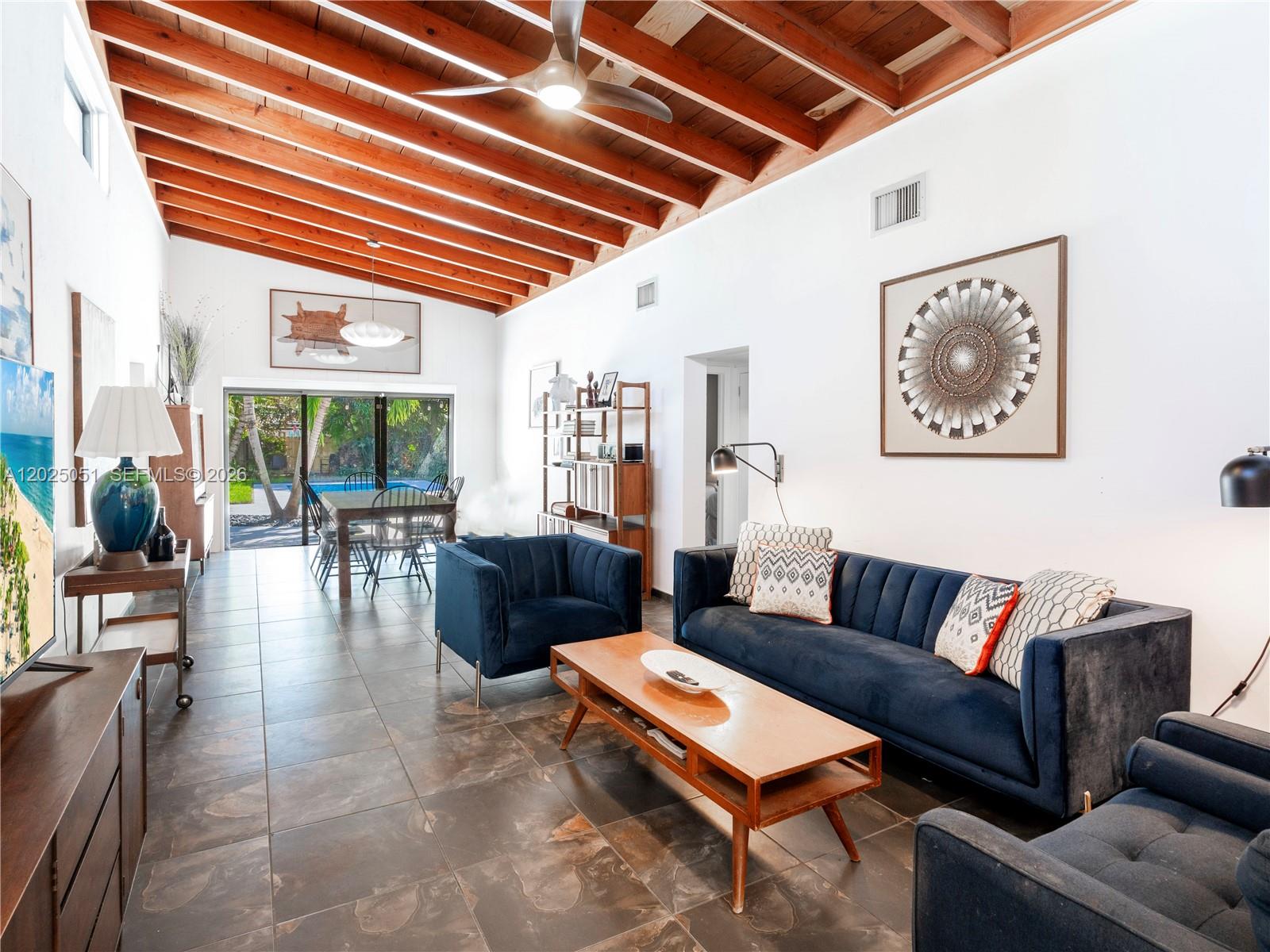 This stunning mid-century modern single-family home perfectly blends vintage charm with modern comfort. Featuring 3 bedrooms & 2 bathrooms, this residence showcases vaulted ceilings, tile flooring, and open-concept living space. Enjoy your brand-NEW pool complete with heater and chiller, surrounded by lush tropical landscaping and a new privacy fence—all less than a year old. The roof was replaced just one year ago, ensuring peace of mind for years to come. This property is being sold fully furnished and has been successfully operated as an Airbnb, making it an ideal turnkey investment opportunity or your own private getaway. Located in the heart of Fort Lauderdale, whether you’re looking for a full-time residence, vacation home, or income-producing property, this one checks all the boxes. Airbnb ready with license.
